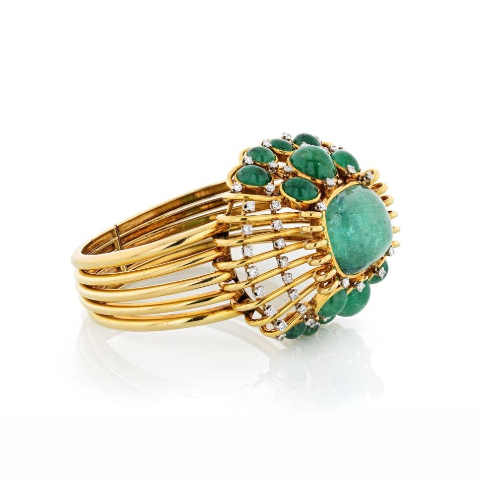 Mauboussin Vintage 18K Gold Emerald Cuff Bangle Bracelet 45 Carat: Mauboussin Vintage 18K Gold Emerald Cuff Bangle Bracelet 45 Carat This exquisite vintage cuff bangle bracelet is crafted from 18K yellow gold and features a stunning square cabochon green emerald at i