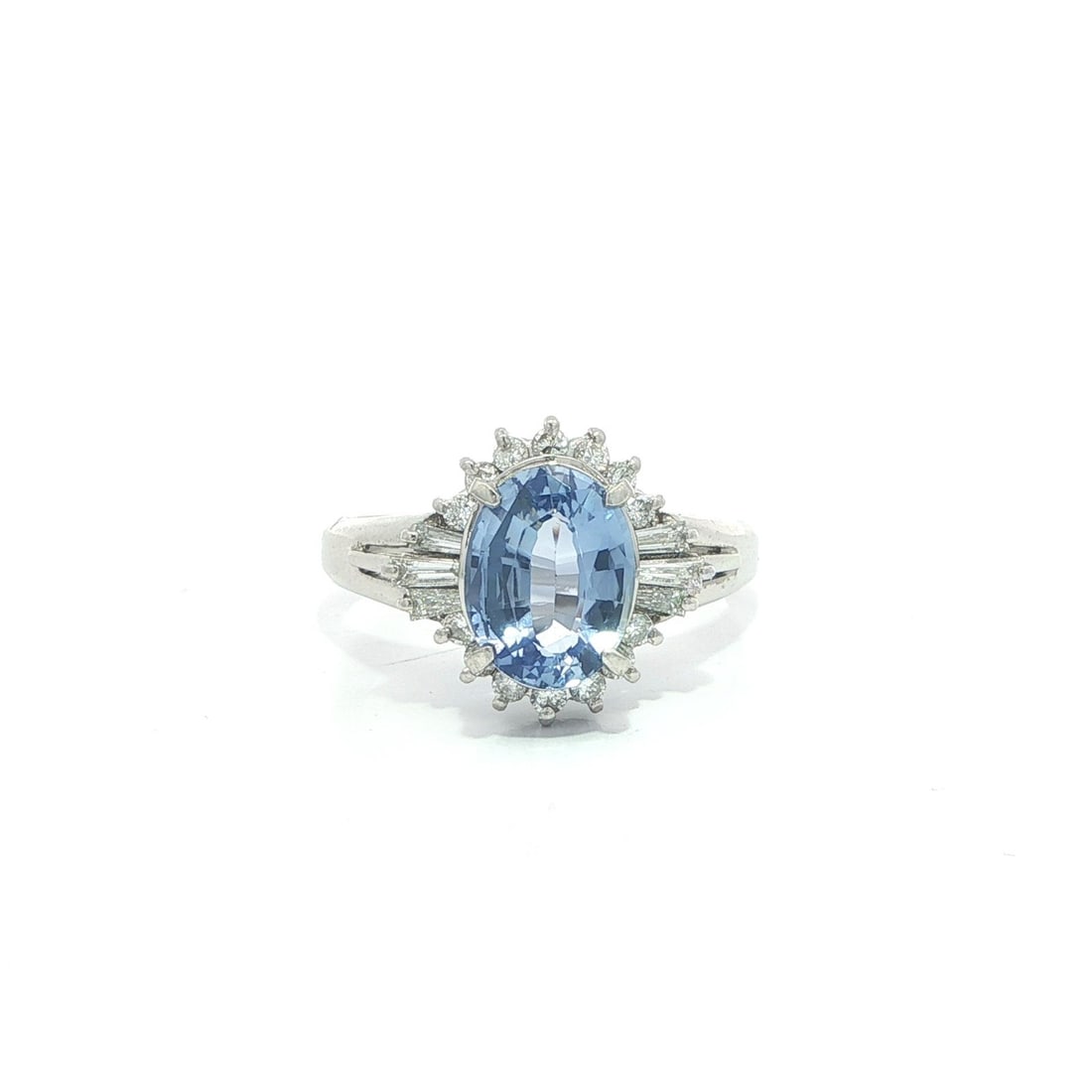 Platinum Ring with 2.31ct GIA Ceylon No Heat Sapphire and Diamonds: Platinum Ring with 2.31ct GIA Ceylon No Heat Sapphire and Diamonds This vintage cocktail ring features a 2.31 carat natural, untreated cornflower blue Ceylon sapphire in an oval cut, prong set at the 