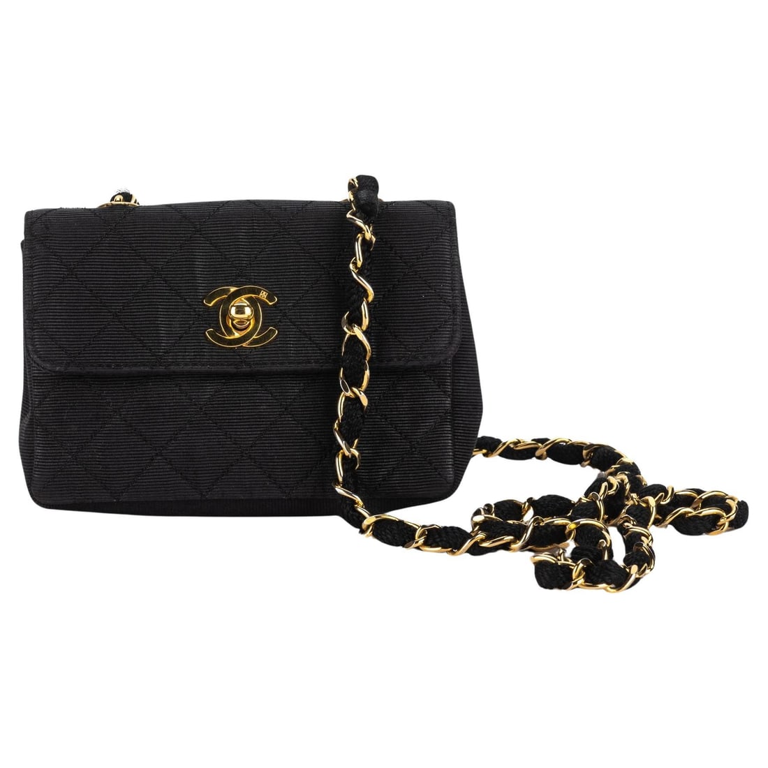 Chanel Black Quilted Canvas Mini Flap Bag with Gold Hardware: Chanel Black Quilted Canvas Mini Flap Bag with Gold Hardware This Chanel Quilted Canvas Mini Flap Bag is a timeless accessory, crafted in France during the 21st century. The bag features luxurious dia