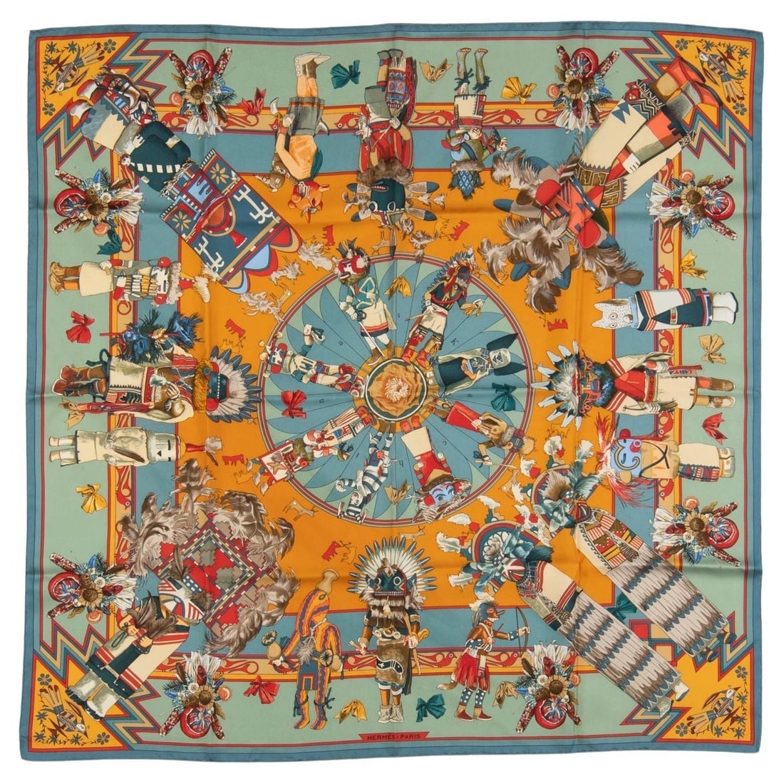 Hermes silk Kachina motif scarf 90 cm hand rolled edges: Hermes silk Kachina motif scarf 90 cm hand rolled edges This Hermes scarf features a vibrant Kachina motif in shades of blue and light green. Crafted from fine silk, it measures 90 cm and is finished 
