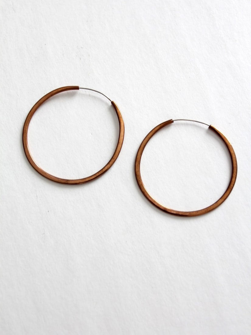 Vintage Copper Hoop Earrings with Invisible Closure 2.5 Inch: Vintage Copper Hoop Earrings with Invisible Closure 2.5 Inch These vintage copper hoop earrings boast a stunning rich patinated finish and feature an invisible closure for a secure fit. Their classic 