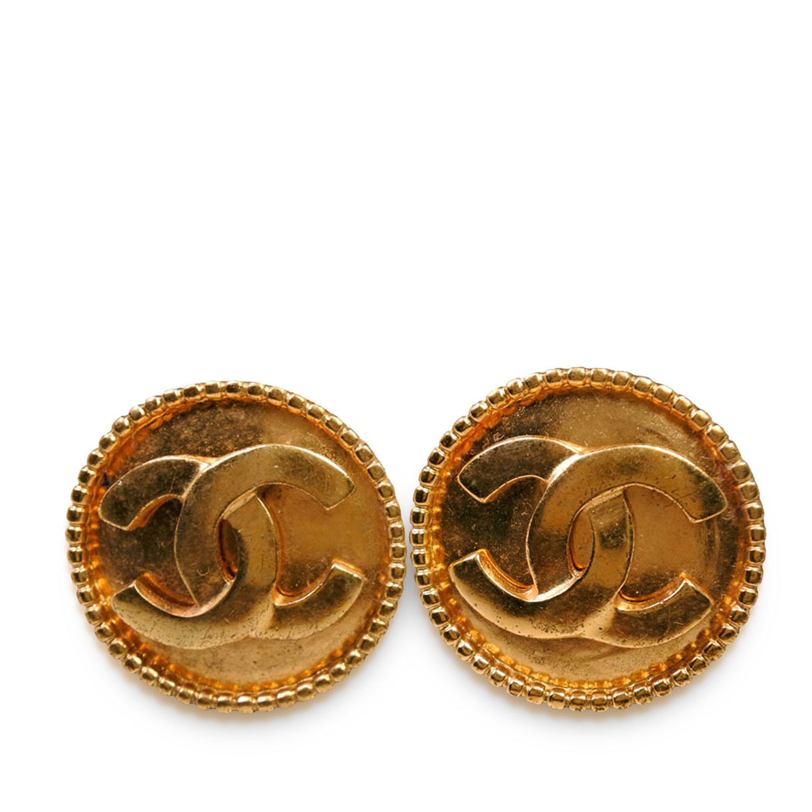 Chanel CC Round Gold Plated Metal Clip On Earrings: Chanel CC Round Gold Plated Metal Clip On Earrings These Chanel earrings feature gold plated round metal bodies with back clip-on closures. Notable for their iconic CC design, they are categorized as 