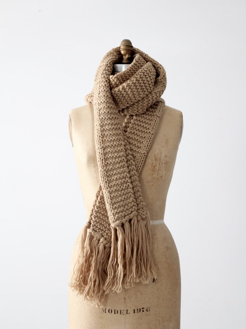 Vintage Extra Long Beige Knit Scarf with Tassels: Vintage Extra Long Beige Knit Scarf with Tassels Wrap yourself in style with this vintage extra-long knit scarf. Crafted from soft acrylic, this chunky beige scarf not only provides warmth but also ad