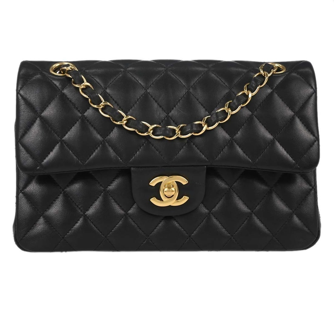 CHANEL Classic Double Flap Small black lambskin shoulder bag: CHANEL Classic Double Flap Small black lambskin shoulder bag Chanel black lambskin small Classic Double Flap shoulder bag in matelasse pattern with a flap turnlock closure. It features a shoulder stra