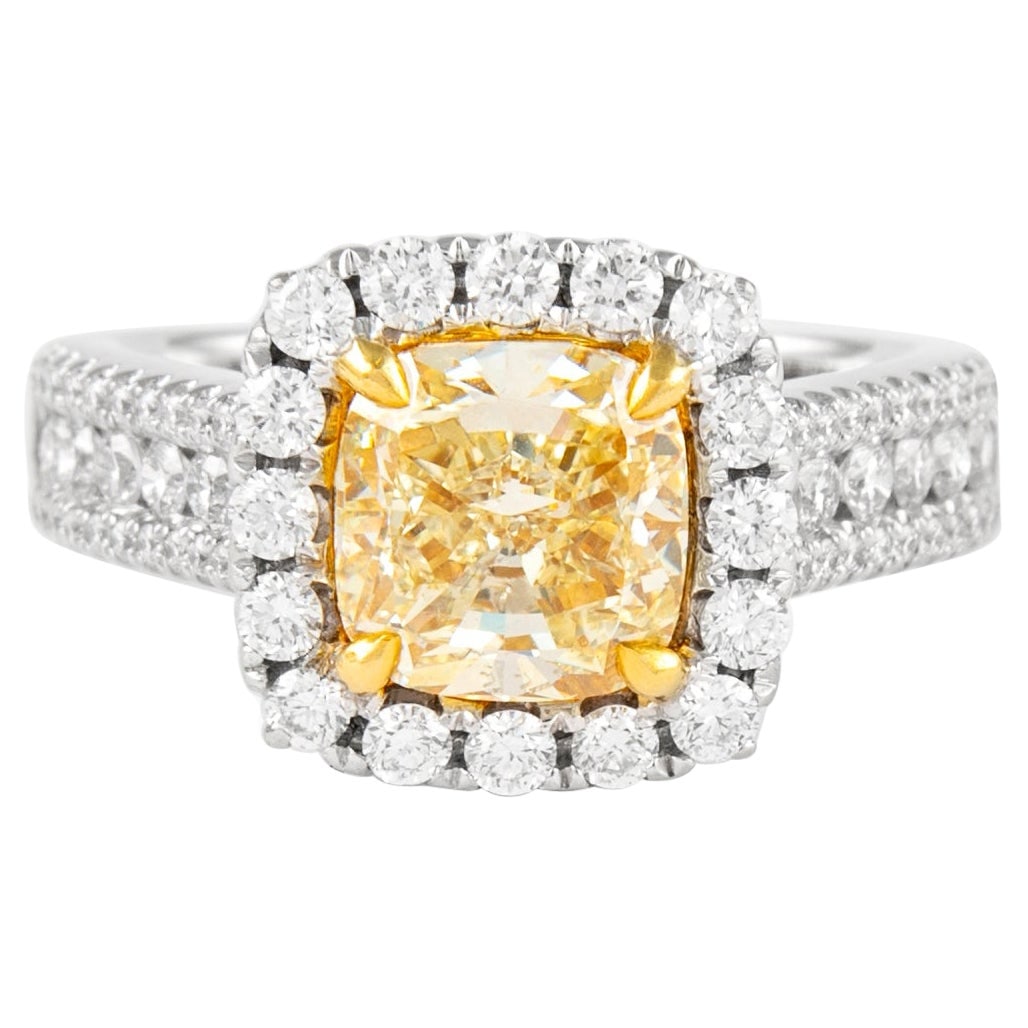 2.38ct Fancy Yellow Diamond Halo Ring 18k Gold EGL Certified: 2.38ct Fancy Yellow Diamond Halo Ring 18k Gold EGL Certified This stunning contemporary ring features a 2.38 carat Fancy Yellow Cushion Cut diamond with SI1 clarity, certified by EGL. The diamond is e