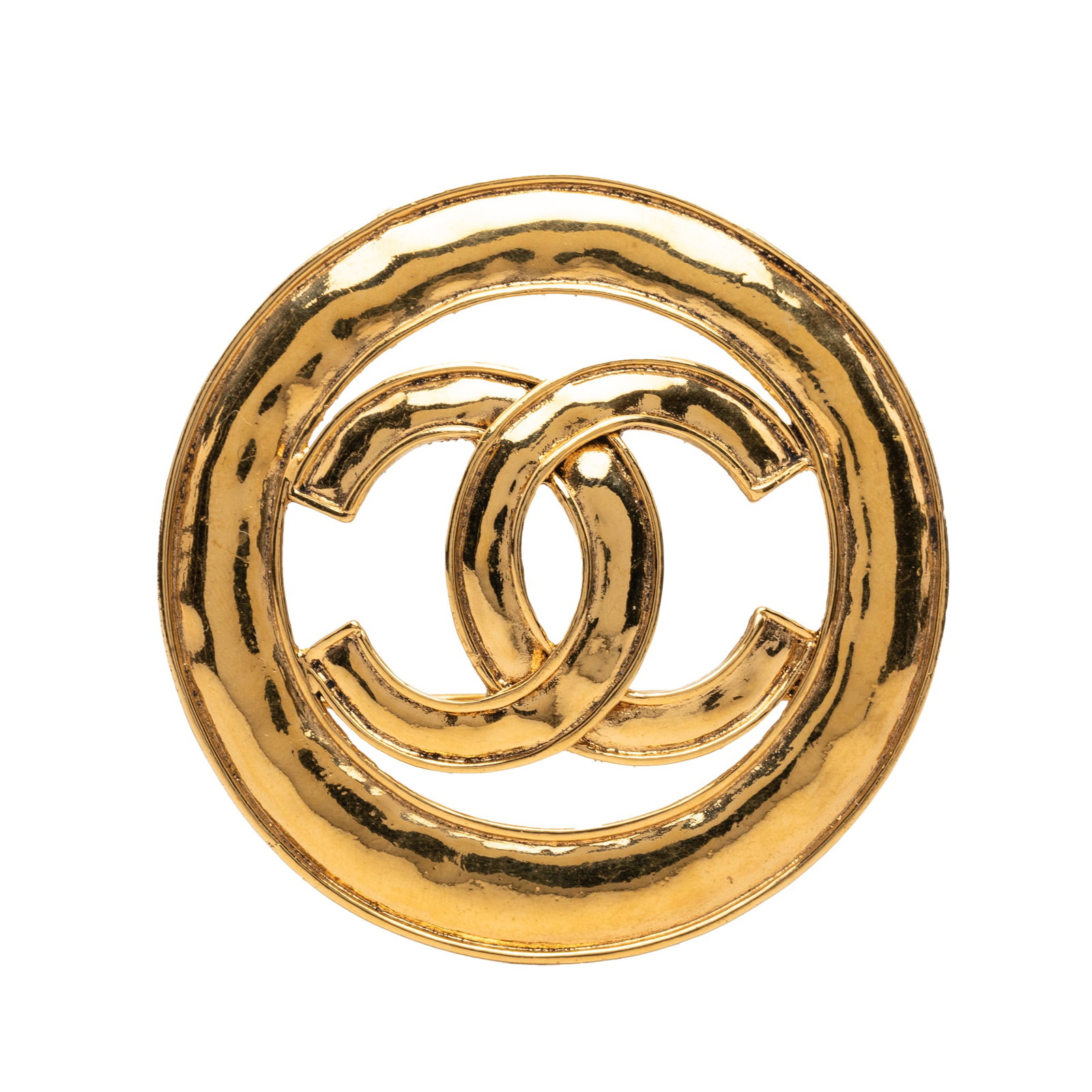 Chanel CC Round Cutout Brooch Gold Plated Metal: Chanel CC Round Cutout Brooch Gold Plated Metal Gold-tone metal brooch with a cut-out round CC design and back pin closure. It is described as a costume piece from France and is noted in AB condition 