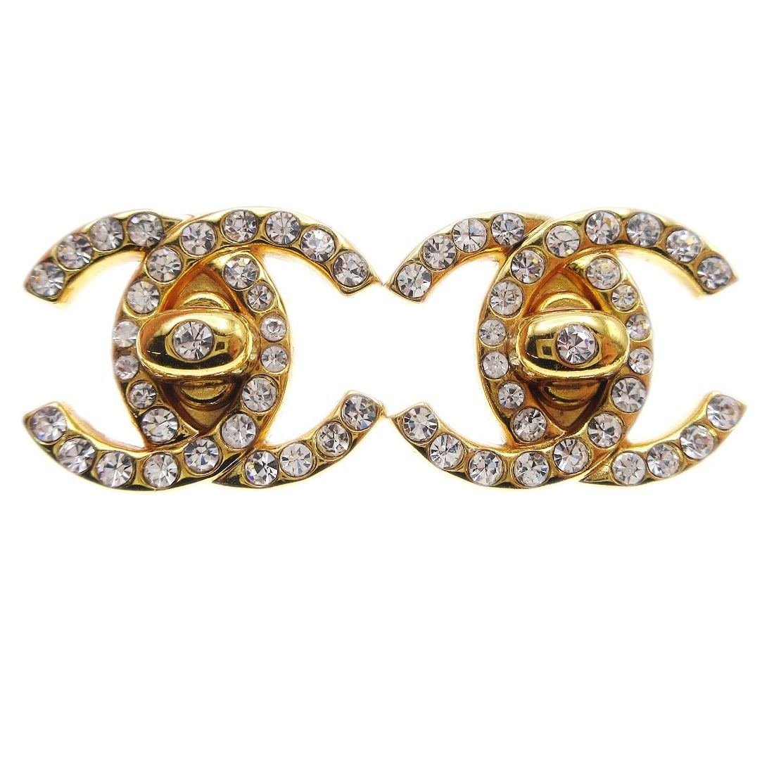 Chanel 96A Gold Plated CC Turnlock Clip On Earrings: Chanel 96A Gold Plated CC Turnlock Clip On Earrings Small Chanel CC turnlock motif clip-on earrings with rhinestone accents. Made in France, these gold-plated earrings feature the iconic Chanel design