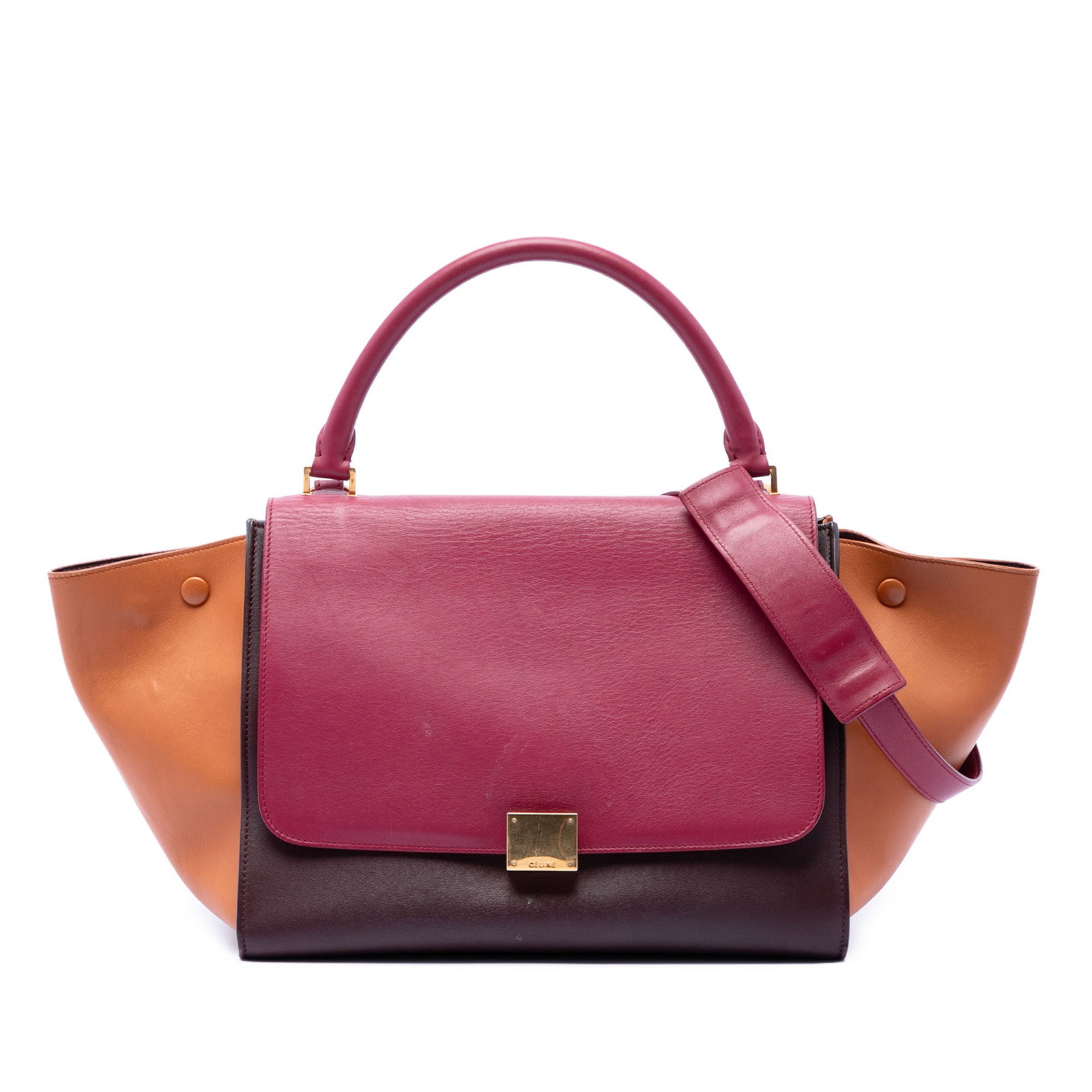 Celine Trapeze Medium Red Leather Satchel: Celine Trapeze Medium Red Leather Satchel This Celine Medium Tricolor Leather Trapeze Satchel showcases a sophisticated design with a leather body, rolled top handle, and a detachable flat leather str