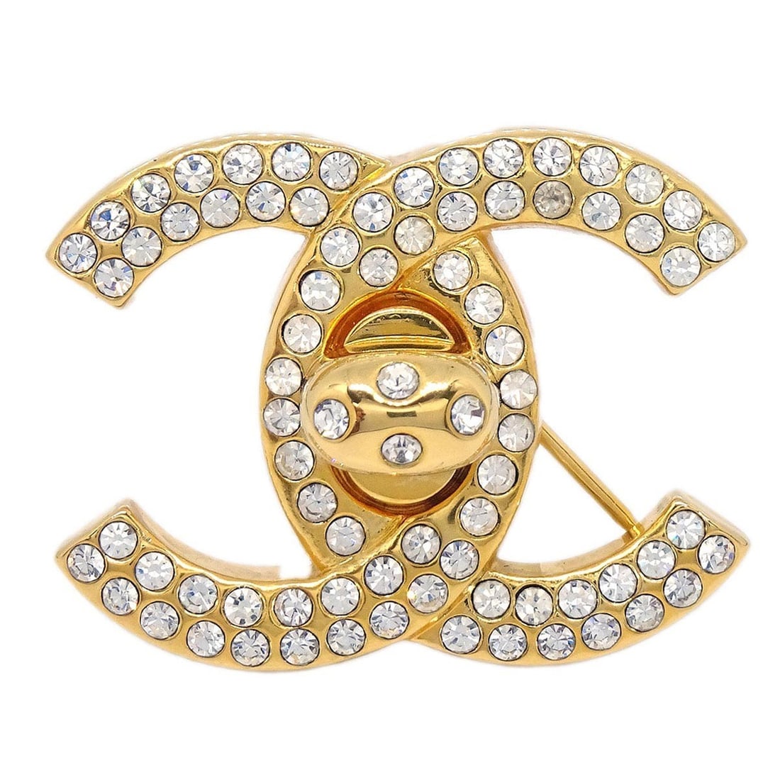 Chanel CC Logo Brooch Gold Plated Rhinestone Turnlock Charm 96A: Chanel CC Logo Brooch Gold Plated Rhinestone Turnlock Charm 96A A Chanel CC turnlock rhinestone charm brooch pin in gold, featuring a logo theme and gold-plated metal with rhinestone material. It is d