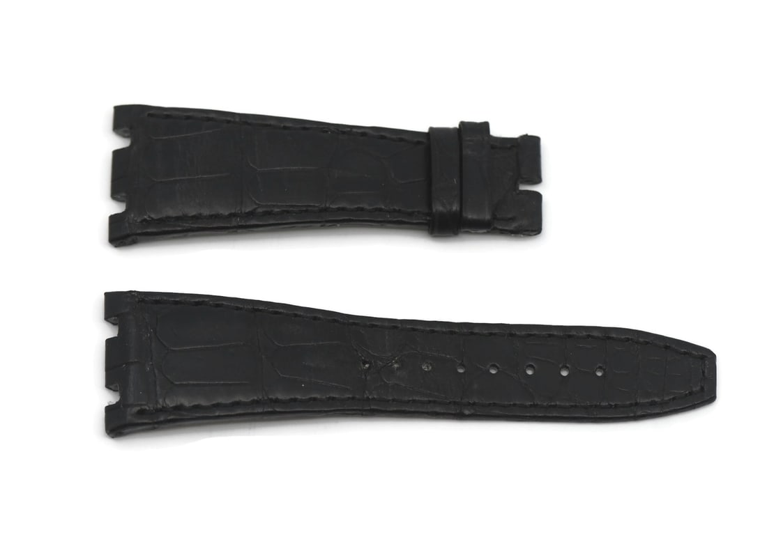 Black 26mm Leather Watch Band for Audemars Piguet: Black 26mm Leather Watch Band for Audemars Piguet This Audemars Piguet black leather wristwatch band is crafted from genuine leather and is designed for a 26 mm width attachment. The strap measures 10