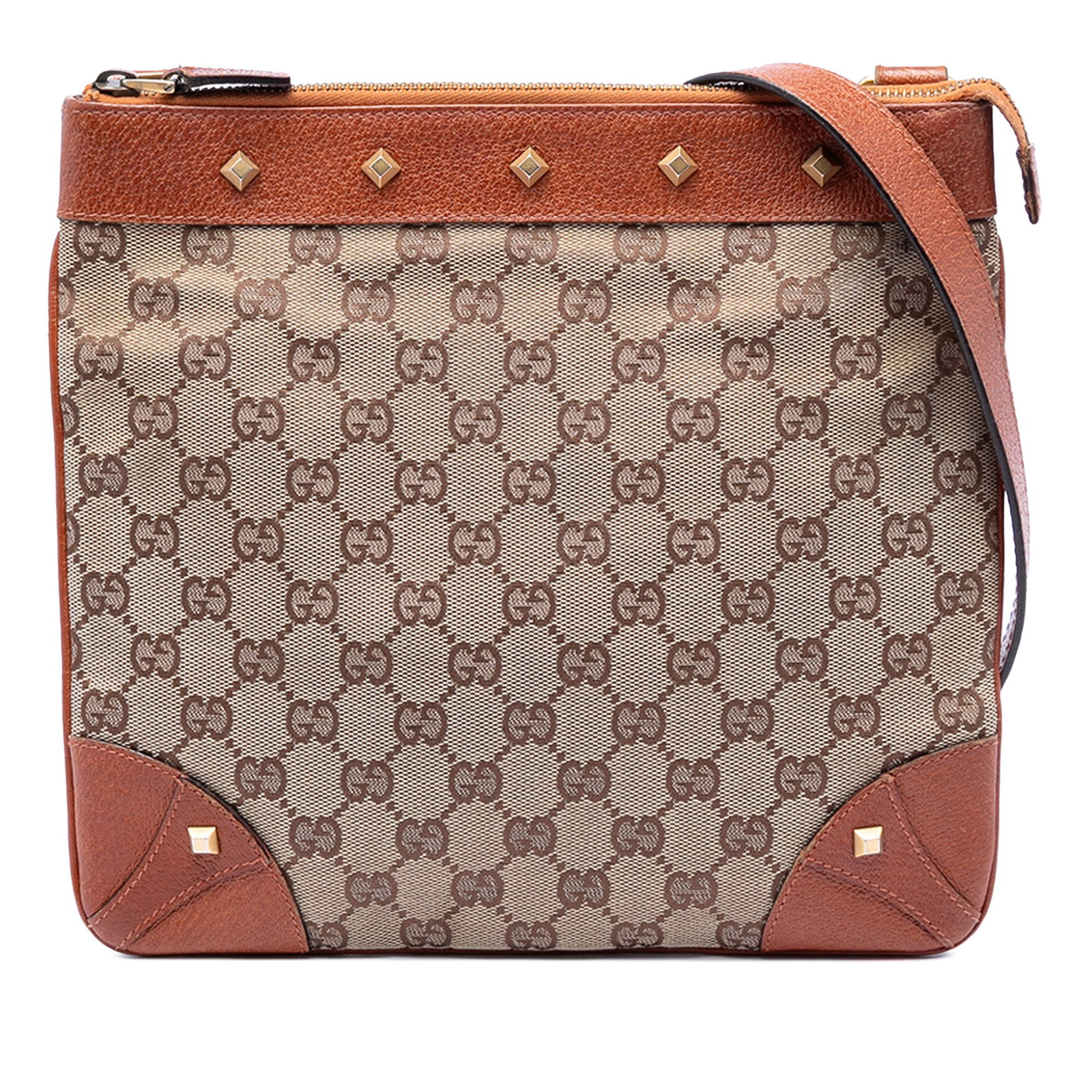 Gucci GG Canvas Nailhead Beige Crossbody Bag: Gucci GG Canvas Nailhead Beige Crossbody Bag This Gucci GG Canvas Nailhead Crossbody bag features a beige canvas body with leather trim, a flat leather strap, a top zip closure, and both interior zip 