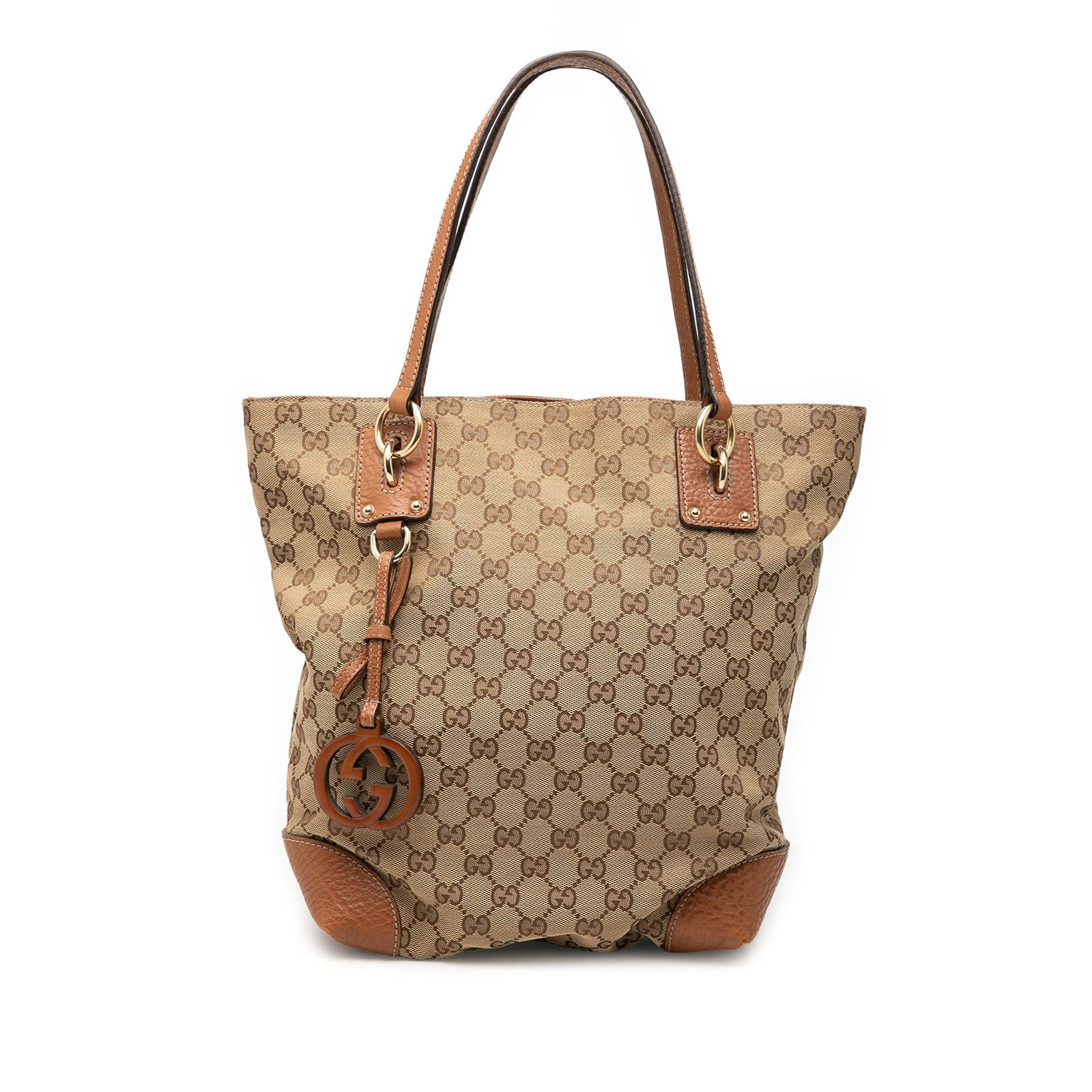 Gucci GG Charm Medium Canvas Tote Bag Beige: Gucci GG Charm Medium Canvas Tote Bag Beige Gucci Medium GG Canvas GG Charm Tote in beige fabric with leather trim and a GG charm. This tote features flat leather handles, an open top with a magnetic 