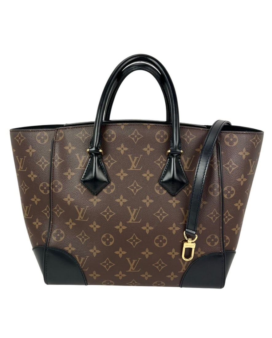 Louis Vuitton Phenix Monogram Canvas Leather Medium Tote: Louis Vuitton Phenix Monogram Canvas Leather Medium Tote Pre-owned Louis Vuitton Phenix tote bag in brown monogram canvas and leather with black leather handles and a black microfiber lining. This med