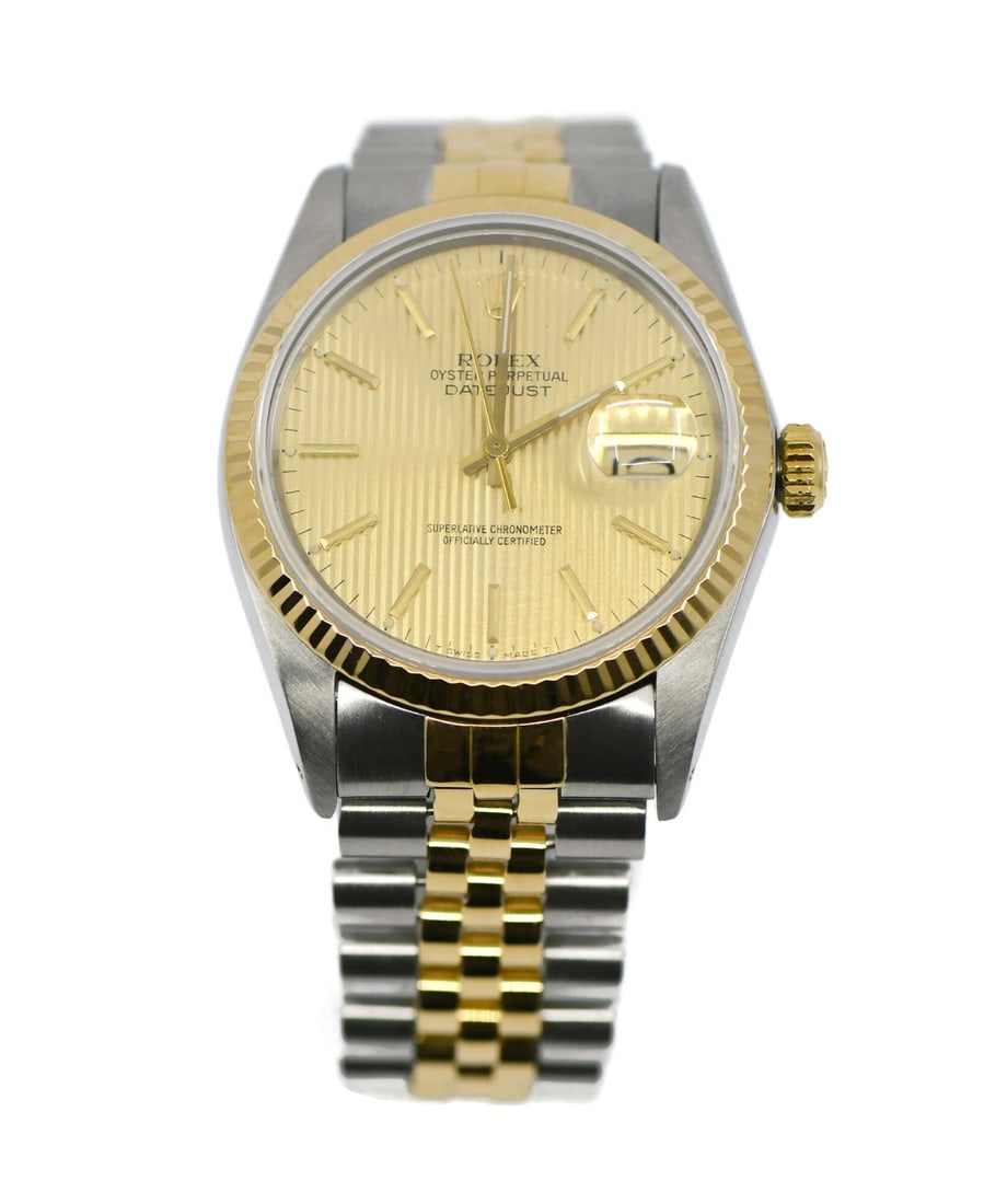 Rolex Datejust 16013 18K Steel Automatic Wristwatch with Box: Rolex Datejust 16013 18K Steel Automatic Wristwatch with Box This Rolex Datejust wristwatch features a 36mm polished stainless steel case with an 18K gold bezel and a champagne dial accented by Roman 
