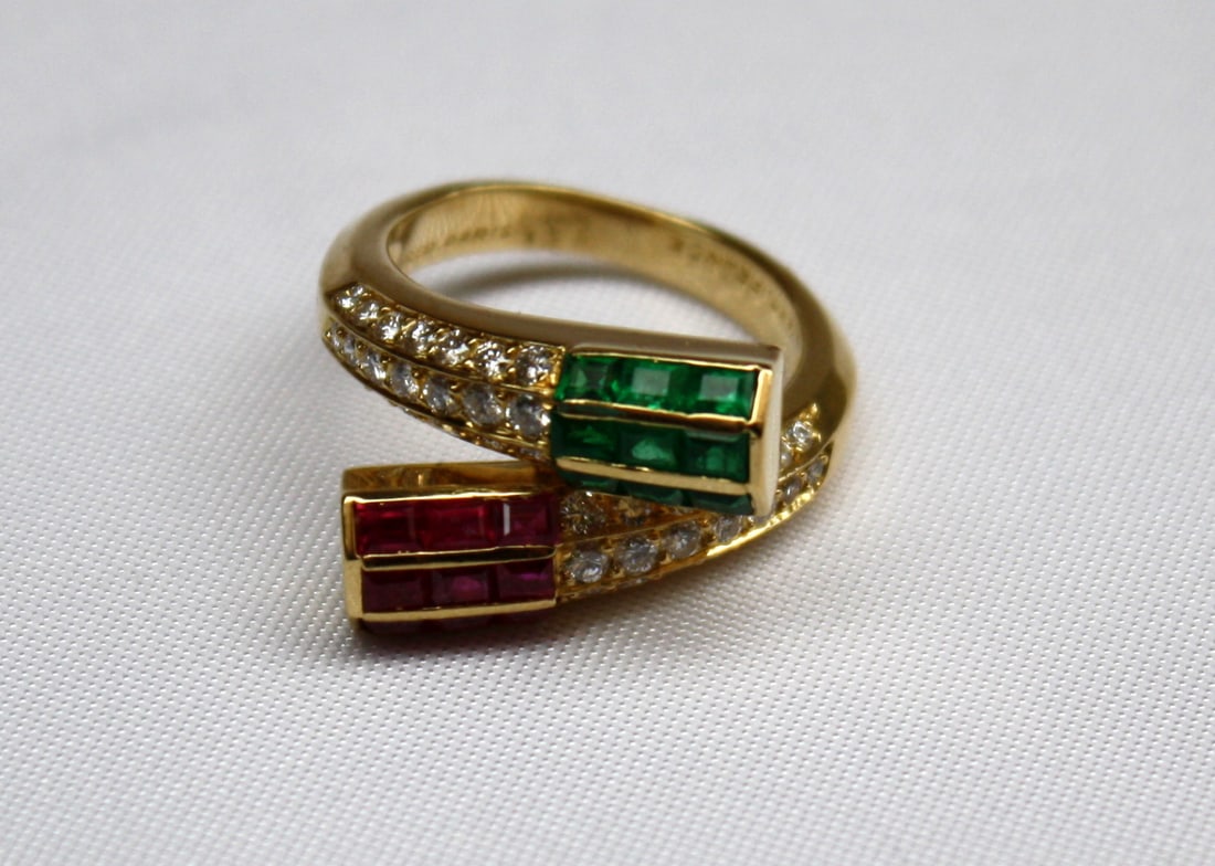 Stunning Fred 18K Yellow Gold Bypass Ring with Ruby Emerald Diamond: Stunning Fred 18K Yellow Gold Bypass Ring with Ruby Emerald Diamond This stunning bypass ring showcases exquisite craftsmanship from Fred, featuring a captivating design that highlights the vibrant hu