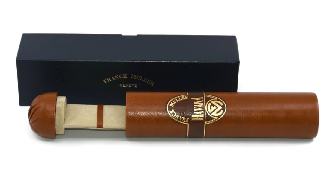Franck Muller Havana single presentation box 13x3x3 inches: Franck Muller Havana single presentation box 13x3x3 inches This is a pre-owned Franck Muller Havana presentation box designed for a single watch. The box features a brown color and was made in Switzer