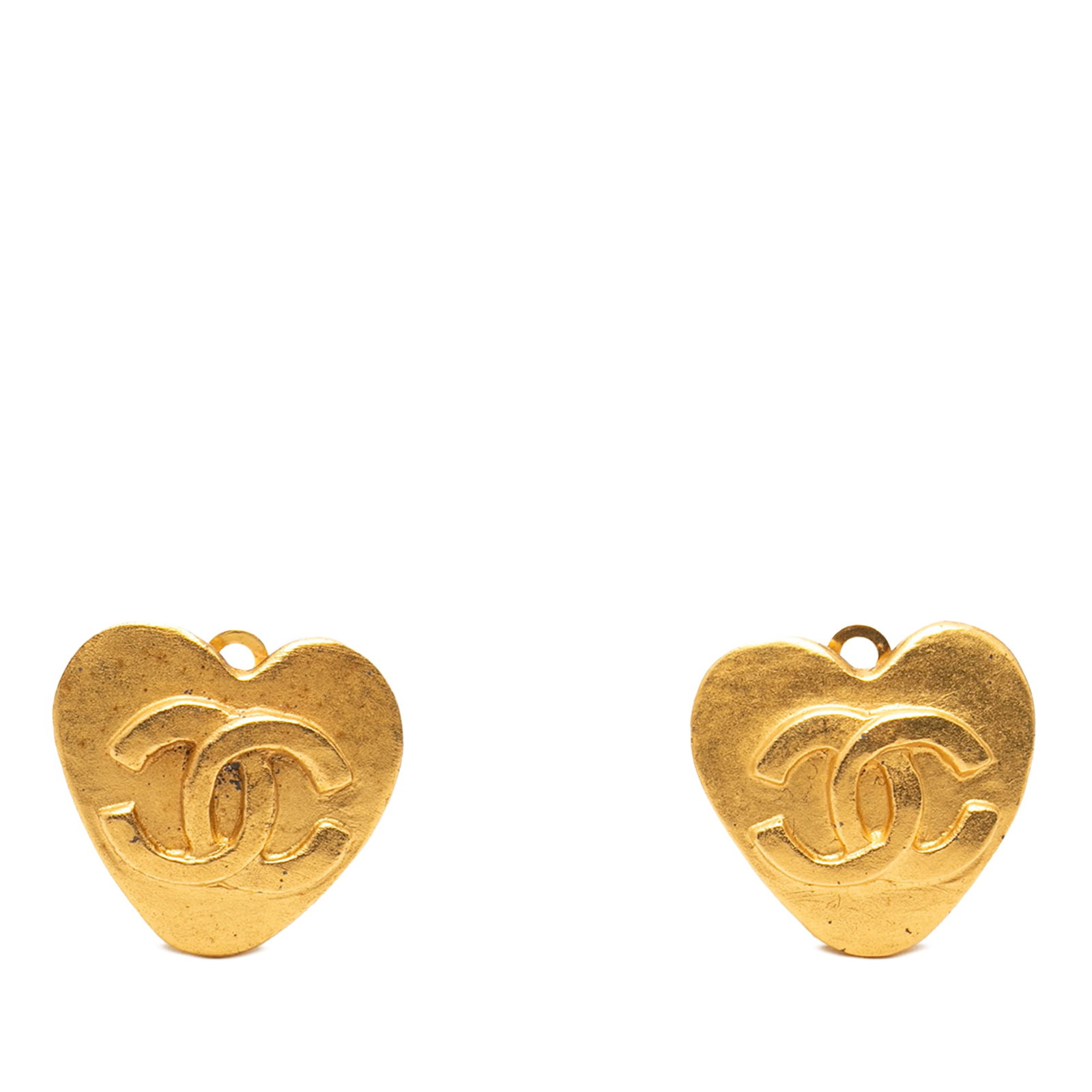Chanel heart clip on earrings gold plated CC: Chanel heart clip on earrings gold plated CC These Chanel CC heart-shaped earrings feature gold-plated metal bodies and secure back clip-on closures. They are categorized as costume jewelry and displa