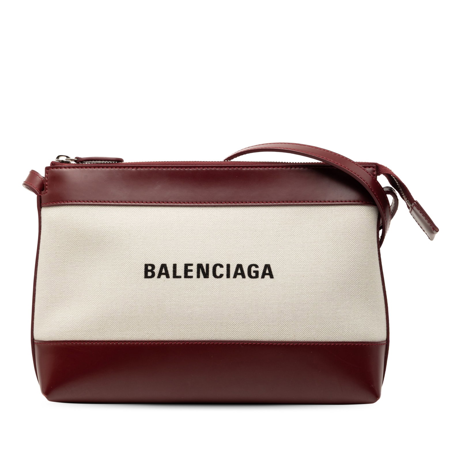 Balenciaga Canvas Crossbody Bag with Leather Trim and Logo Detail: Balenciaga Canvas Crossbody Bag with Leather Trim and Logo Detail This Balenciaga crossbody bag features a brown canvas body with leather trim, an adjustable flat leather strap, a top zip closure, and