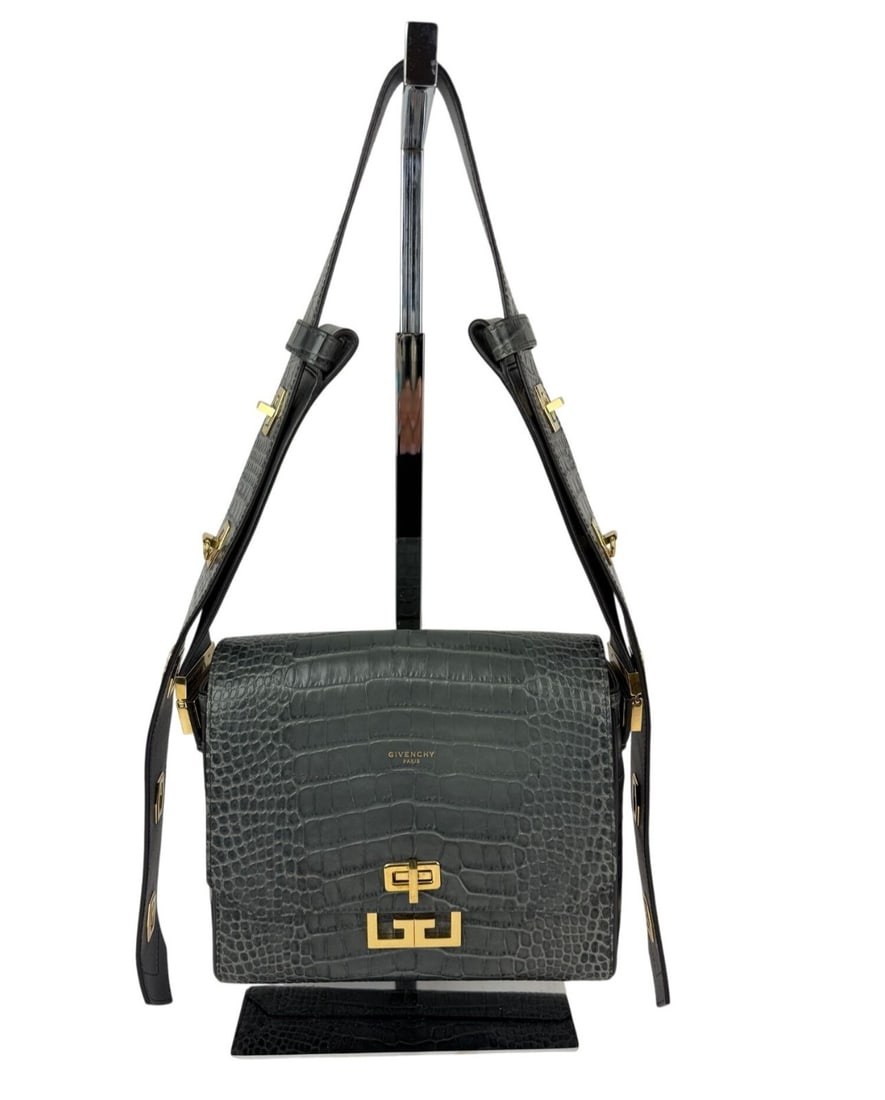 Givenchy Eden Gray Crocodile Embossed Leather Shoulder Bag: Givenchy Eden Gray Crocodile Embossed Leather Shoulder Bag This Givenchy Eden shoulder bag features a crocodile-embossed leather exterior in storm gray with a coated finish. The medium-sized, rectangu
