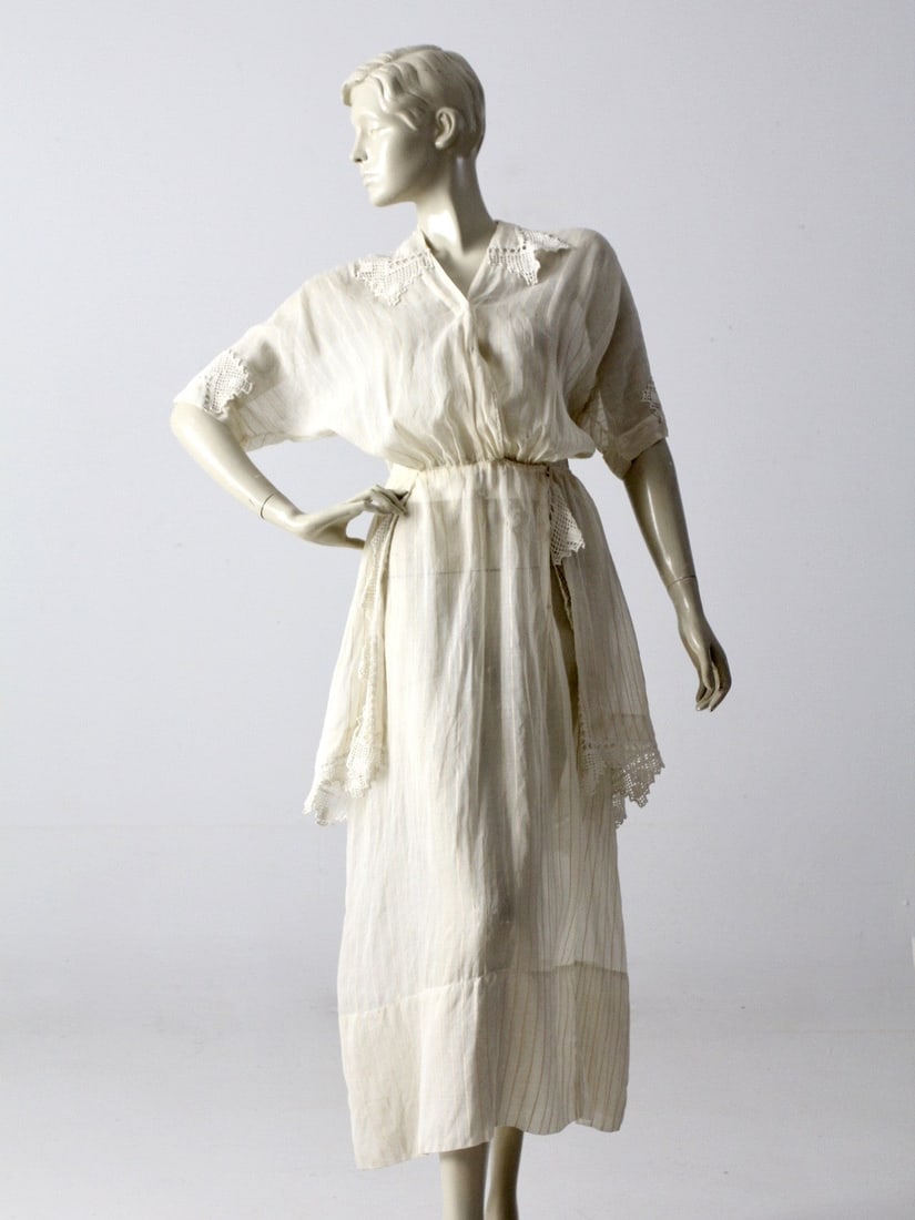 Antique Edwardian Ivory Cotton Tea Dress with Gold Pin-Striping: Antique Edwardian Ivory Cotton Tea Dress with Gold Pin-Striping Step back in time with this exquisite antique Edwardian era tea dress, a stunning piece from our Stylist's Collection. Crafted from ivor