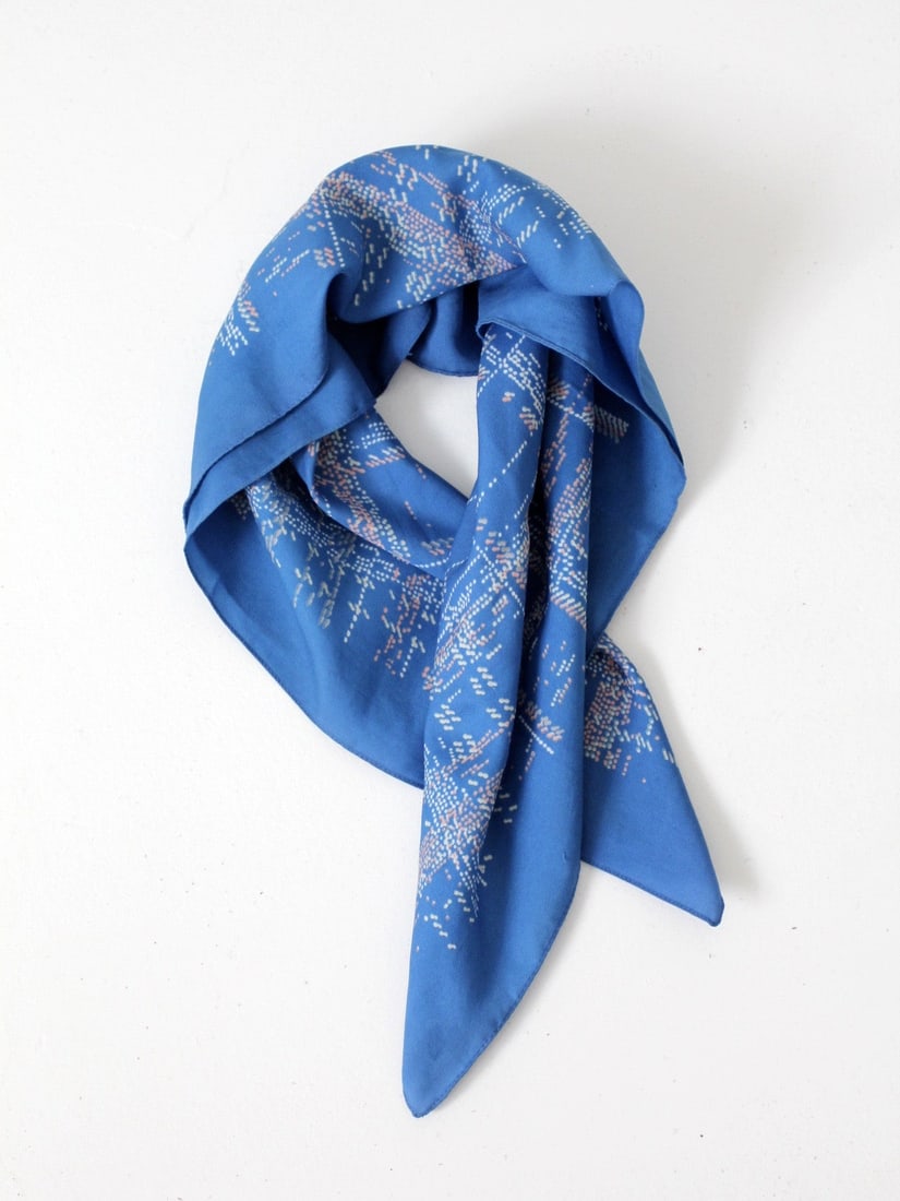 Vintage Blue Faux Silk Hair Scarf with Checker Print: Vintage Blue Faux Silk Hair Scarf with Checker Print This vintage hair scarf showcases a beautiful faux silk material in a vibrant blue hue. It features an eye-catching abstract checker print in pink 