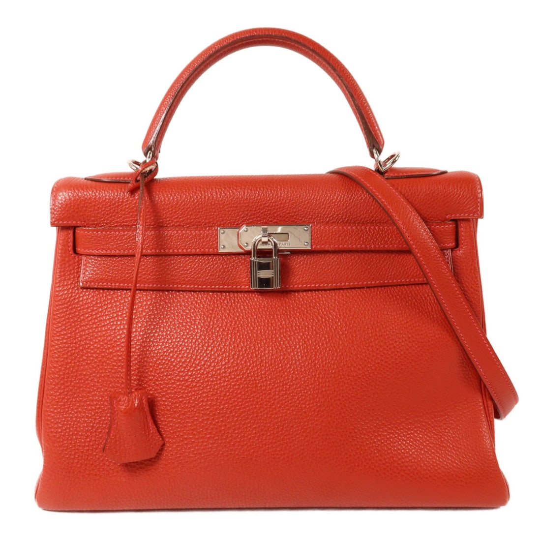 Hermes Kelly 32 Taurillon Clemence Shoulder Handbag Rouge H PHW: Hermes Kelly 32 Taurillon Clemence Shoulder Handbag Rouge H PHW A HERMES Kelly 32 2-way shoulder bag in Taurillon Clemence leather and calfskin (cowhide) in Rouge H. It features a turn lock closure, a