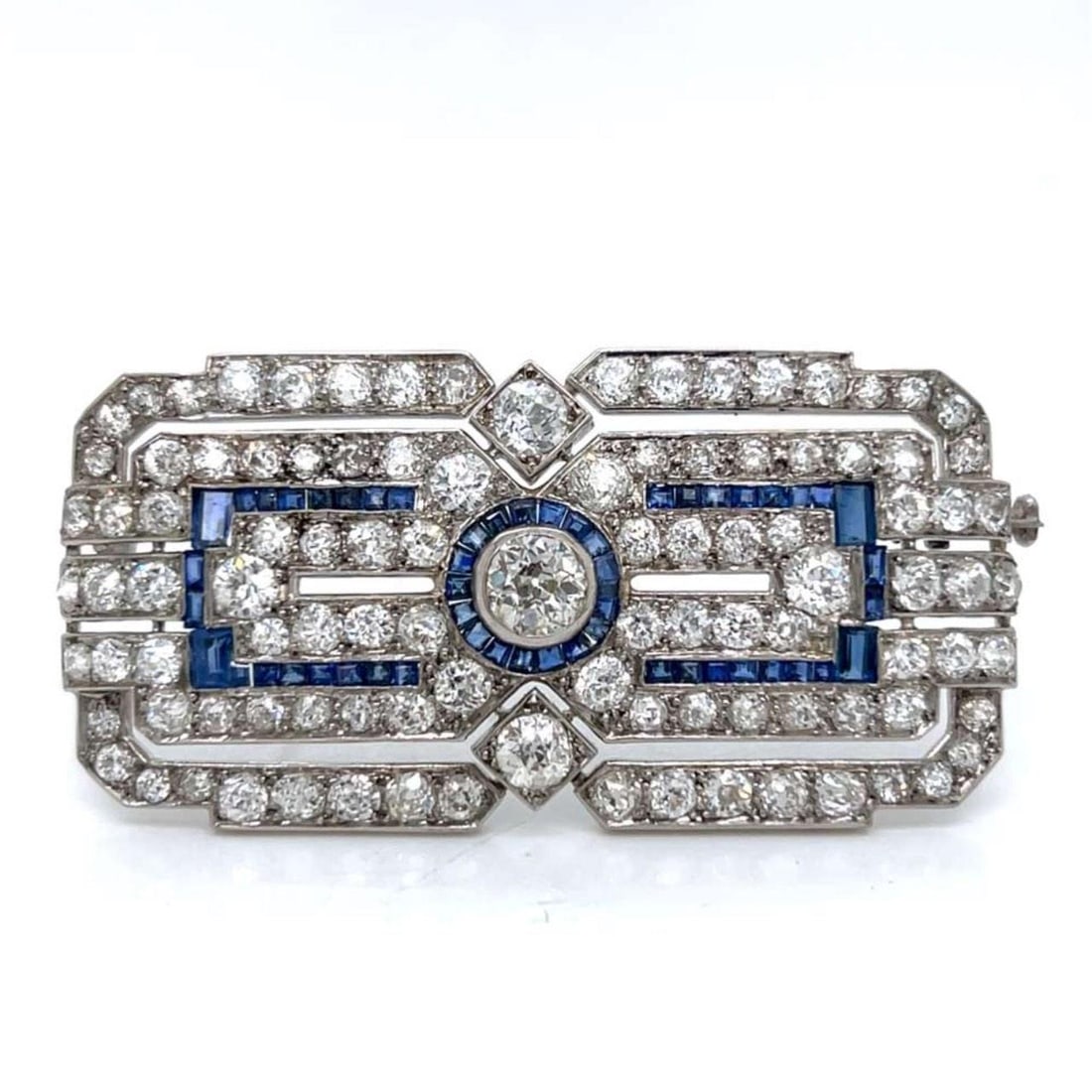 Art Deco Platinum Brooch with Sapphires and Diamonds in Original Box: Art Deco Platinum Brooch with Sapphires and Diamonds in Original Box This French Art Deco brooch is crafted from platinum and features 54 sapphires with an approximate total weight of 3.00 carats, as 