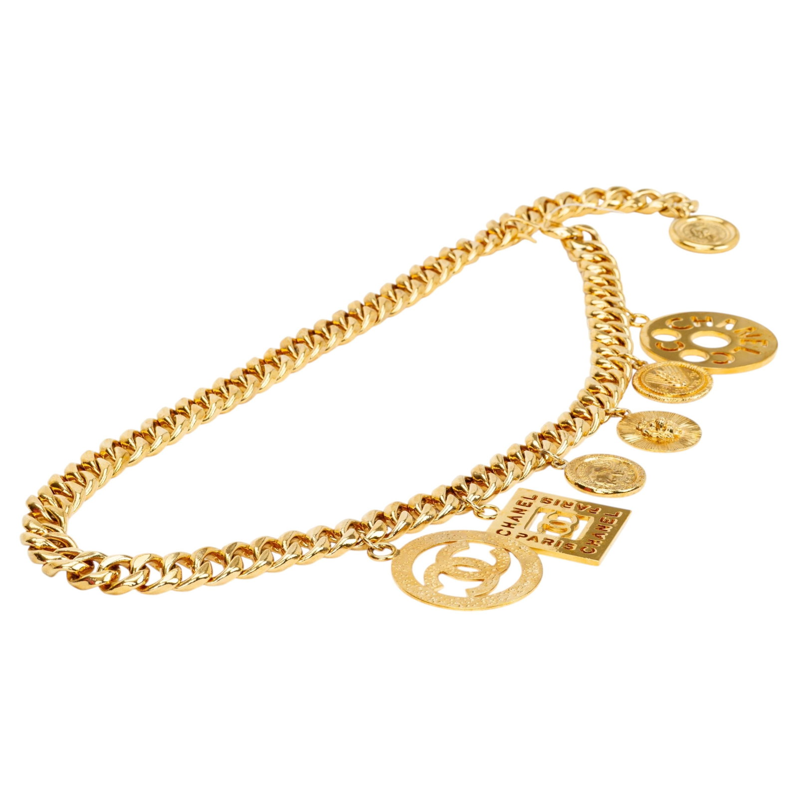Chanel 1980s Gold Plated Oversized Charm Chain Belt: Chanel 1980s Gold Plated Oversized Charm Chain Belt This rare Chanel charm belt from the 1980s features a thick curb link chain adorned with six iconic Chanel charms. Crafted in France from gold plate