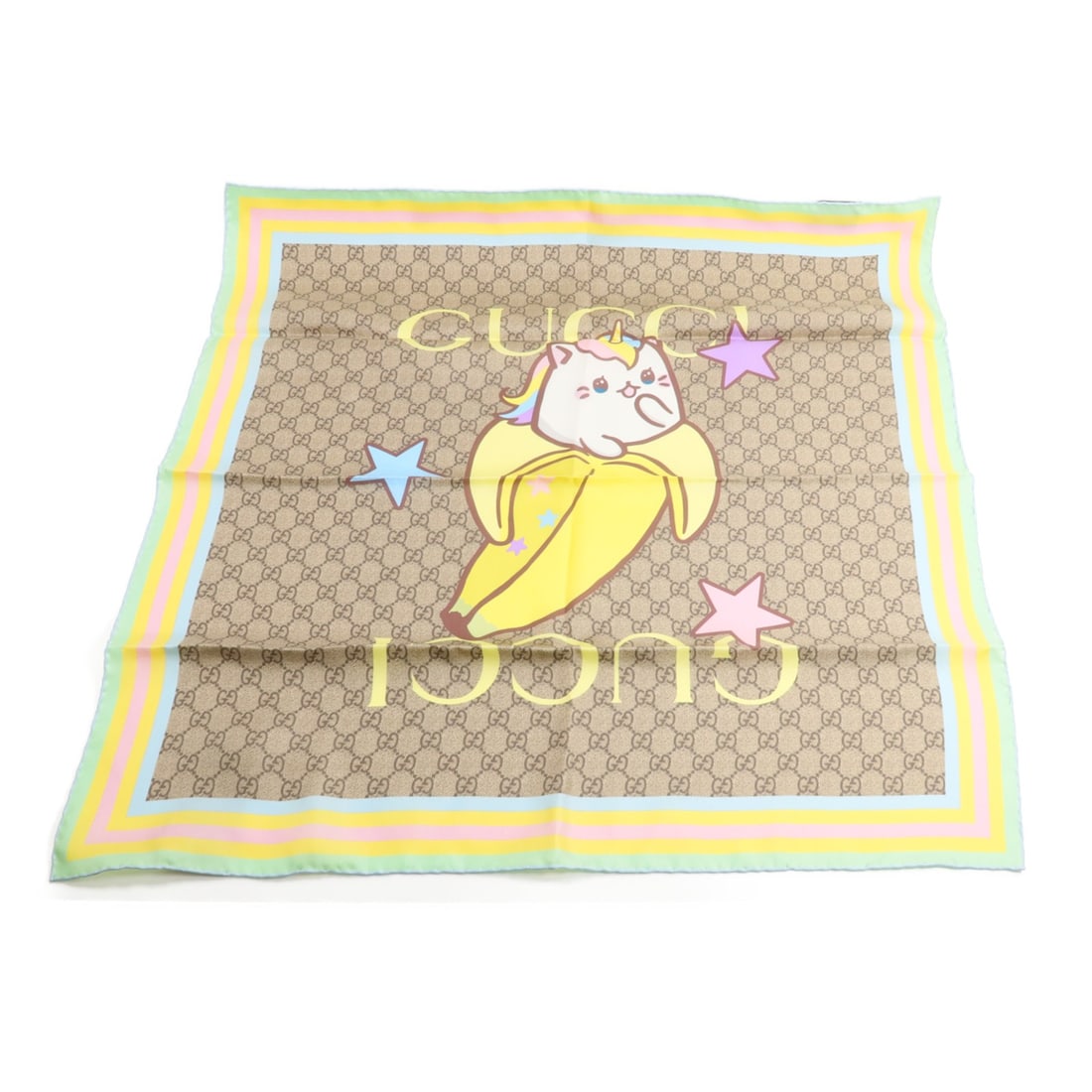 GUCCI 704132 GucciXBananya Silk Scarf 70cm x 70cm Brown Multicolor: GUCCI 704132 GucciXBananya Silk Scarf 70cm x 70cm Brown Multicolor A Gucci GG GucciXBananya scarf in brown and multicolor, made of silk and measuring 70 cm x 70 cm. It comes with a storage box and is 