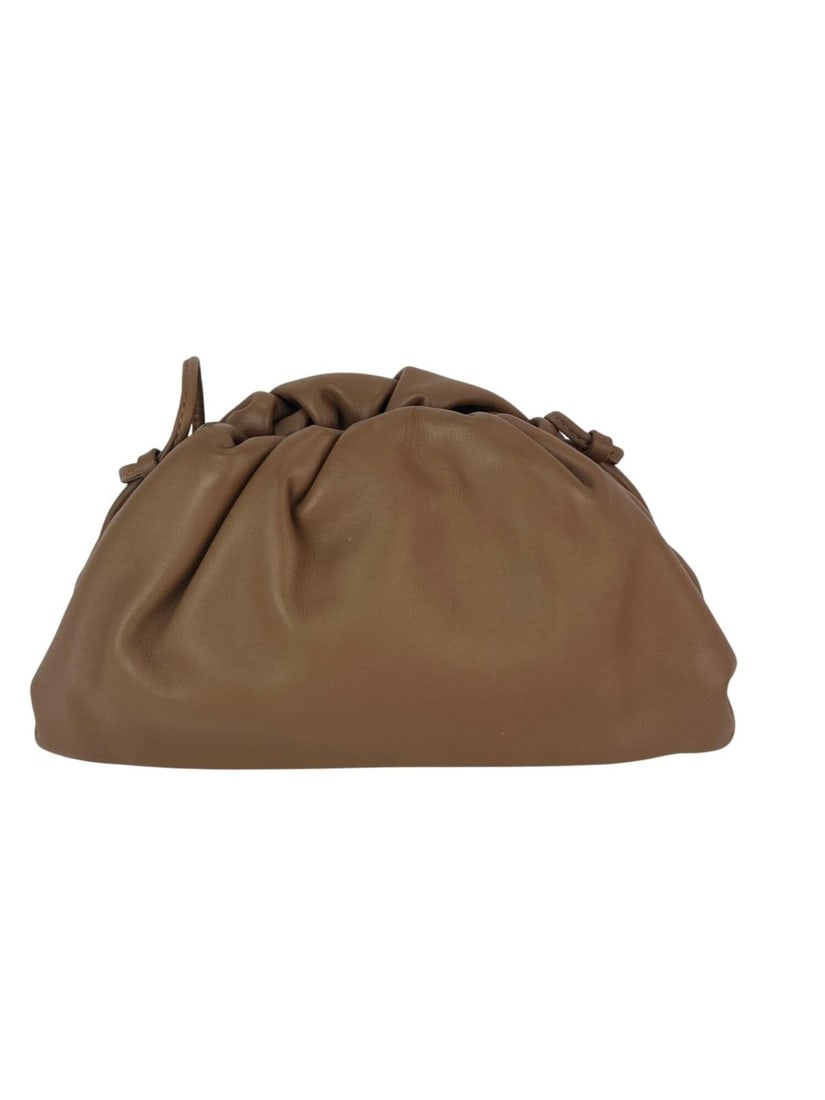Bottega Veneta Mini Pouch beige leather crossbody clutch: Bottega Veneta Mini Pouch beige leather crossbody clutch This Bottega Veneta Mini Pouch is crafted from beige leather and features a crescent shape with a matte finish. Designed for versatility, it in