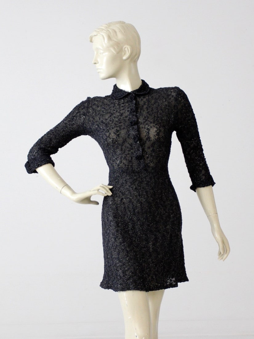 1960s Sydney's Originals Black Knit Mini Dress with Silver Accents: 1960s Sydney's Originals Black Knit Mini Dress with Silver Accents This stunning vintage 1960s black knit mini dress from Sydney's Originals brings a touch of retro elegance to your wardrobe. Crafted 