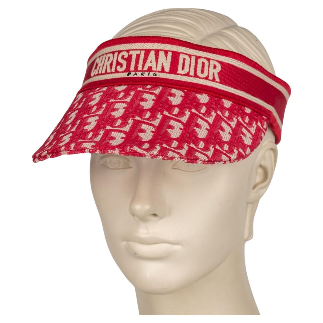 Christian Dior Red Oblique Visor with Signature Band: Christian Dior Red Oblique Visor with Signature Band Experience luxury with the Christian Dior Oblique Visor in a vibrant red hue. This stylish accessory features the iconic Christian Dior Oblique mot