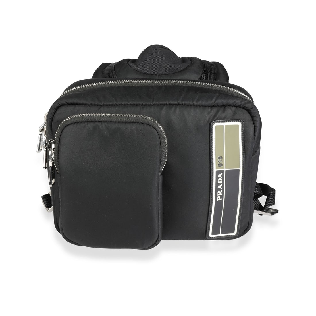 Prada Technical Backpack Black Tessuto Pocket Nylon Unisex: Prada Technical Backpack Black Tessuto Pocket Nylon Unisex Black Prada Tessuto Pocket nylon technical backpack with a zip-around and zip-top closure. It features a fabric exterior and lining, silver-t