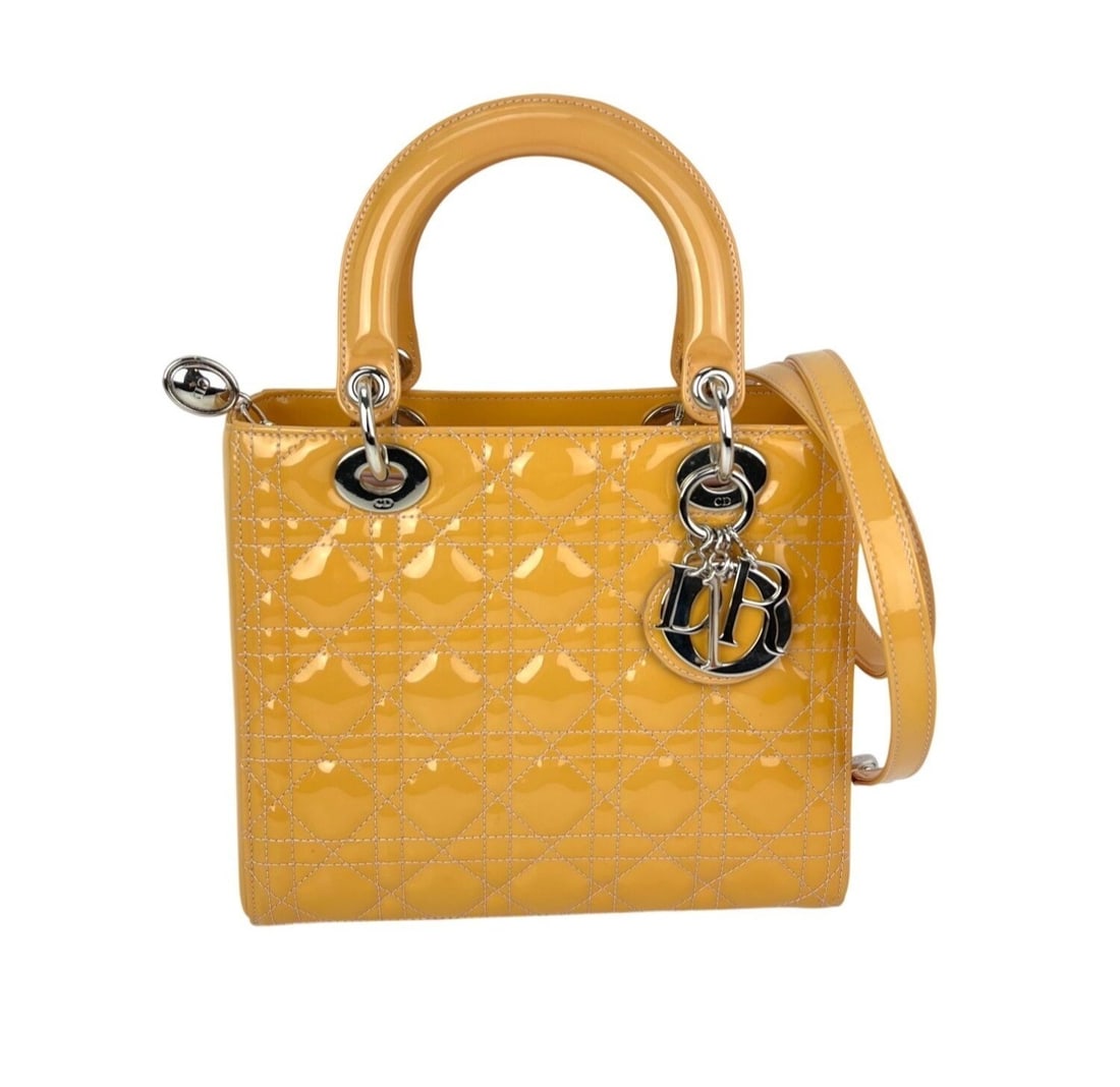 Dior Lady Medium Yellow Patent Leather Shoulder Bag: Dior Lady Medium Yellow Patent Leather Shoulder Bag This Christian Dior Lady Dior bag is crafted from yellow patent leather and features the signature Cannage pattern. It has a medium size with a zip 