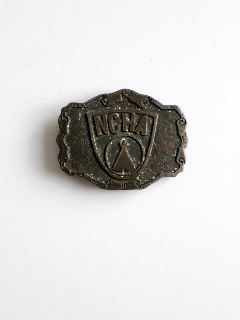 Vintage NCHA Brass Belt Buckle 1970s with Logo: Vintage NCHA Brass Belt Buckle 1970s with Logo This vintage National Campers & Hikers Association (NCHA) brass belt buckle dates back to circa 1970. It features the distinctive NCHA logo on the front 