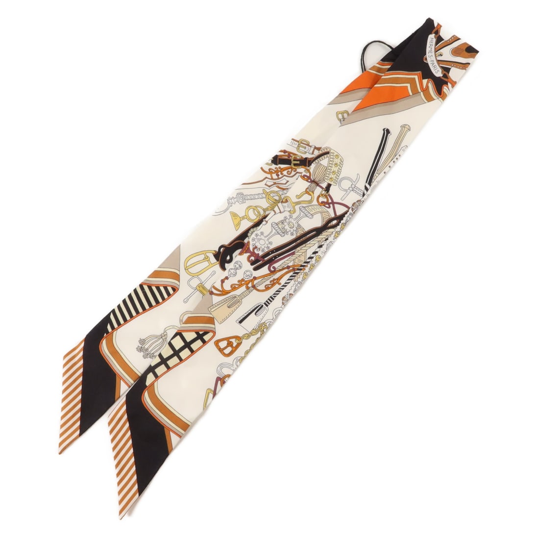 Hermes Twilly Silk Scarf Multicolor with Storage Box: Hermes Twilly Silk Scarf Multicolor with Storage Box A Hermes Twilly scarf in multicolor silk, presented in pristine condition. The item includes a storage box and measures 85 cm x 5 cm (33.5 in x 2.0