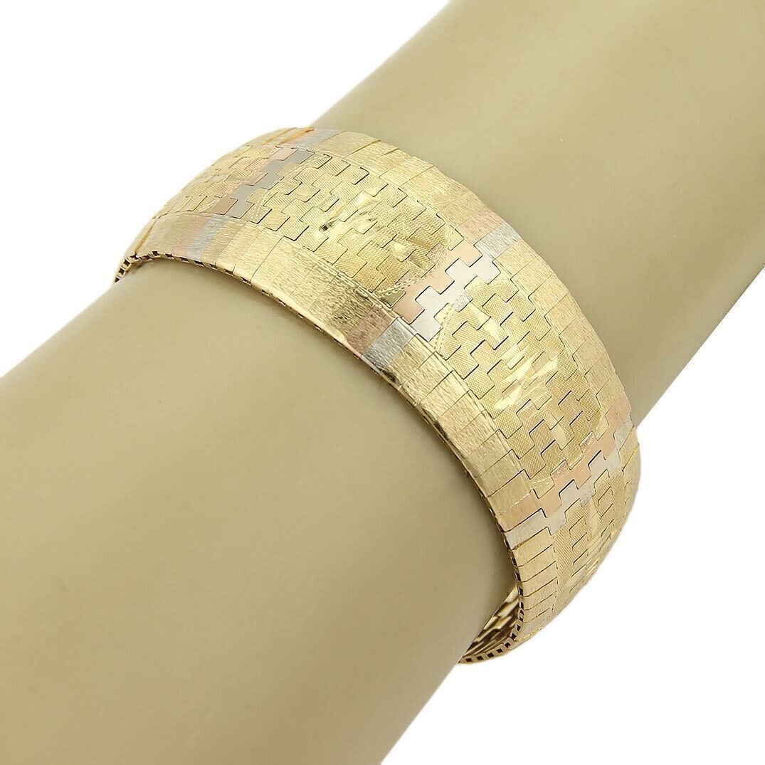18k Yellow White Rose Gold Flex Bracelet Graduated Diamond Cut 56.4g: 18k Yellow White Rose Gold Flex Bracelet Graduated Diamond Cut 56.4g This vintage estate diamond-cut graduated flex bracelet is crafted in 18k yellow, white, and rose gold. It features a flexible cons