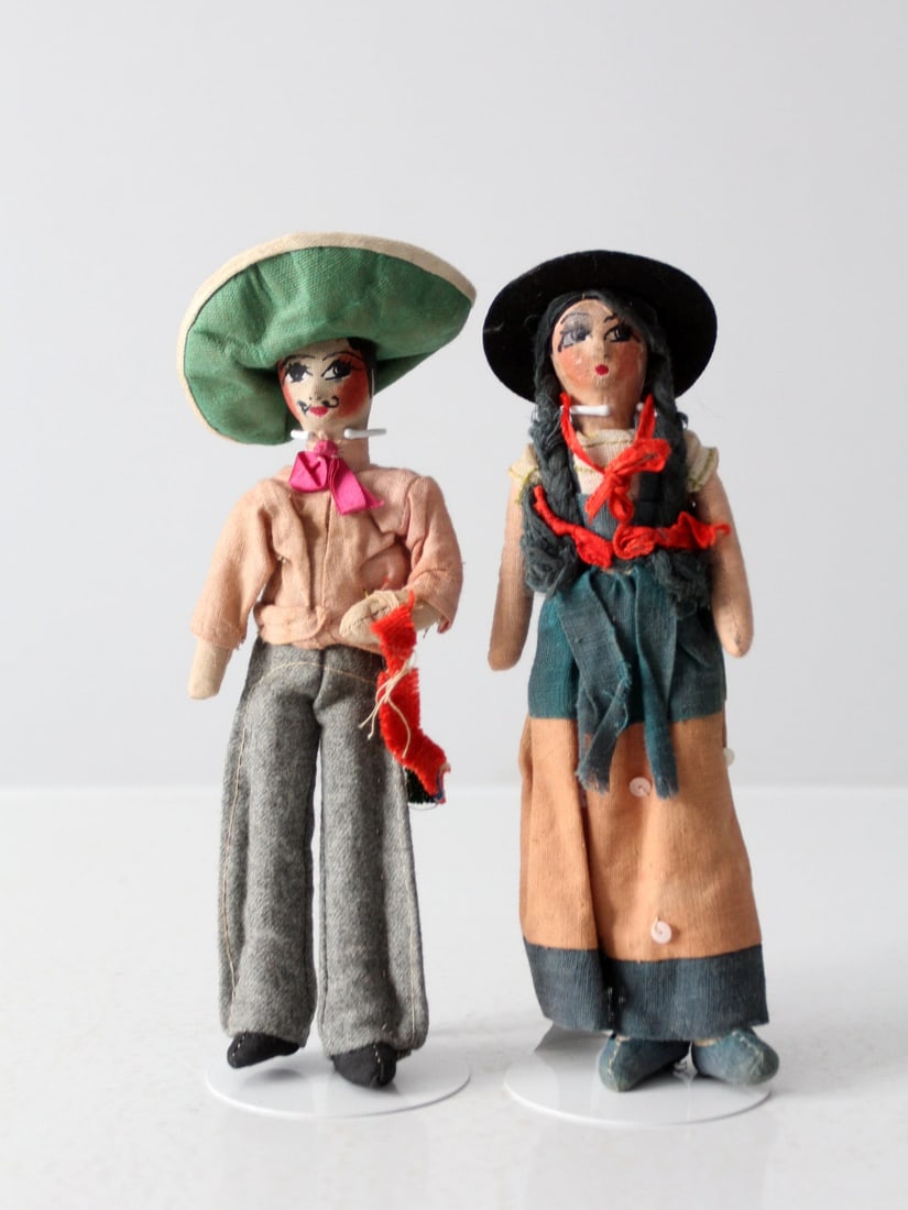 Vintage Mexican Folk Art Dolls Handcrafted Pair with Stands: Vintage Mexican Folk Art Dolls Handcrafted Pair with Stands Discover a stunning pair of vintage Mexican folk art dolls from the early 20th century. Each doll is meticulously handcrafted, showcasing ch