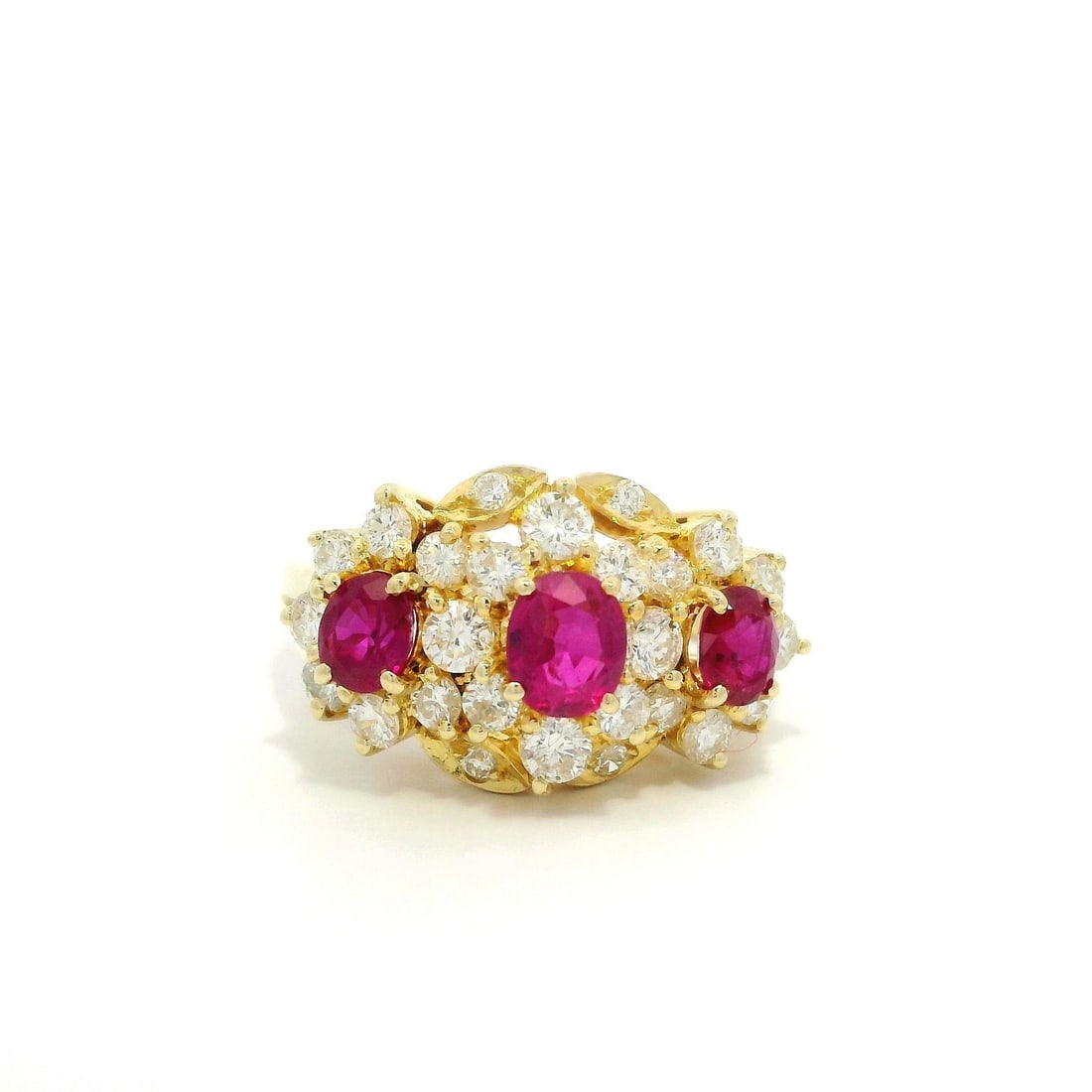 14k Yellow Gold 2ctw Ruby Diamond Cocktail Cluster Ring: 14k Yellow Gold 2ctw Ruby Diamond Cocktail Cluster Ring This stunning cocktail ring features a vibrant cluster design crafted in solid 14k yellow gold. The centerpiece showcases three natural genuine 