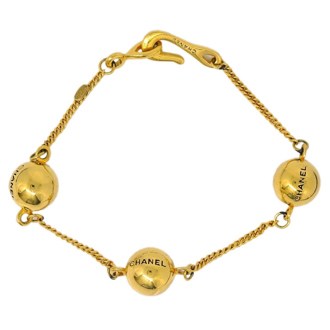 Chanel 98P Gold Plated Medallion Bracelet: Chanel 98P Gold Plated Medallion Bracelet Gold-plated Chanel bracelet from France featuring medallion detailing and a gold-tone finish. Marked 98P, this piece shows visible wear including peeling to t