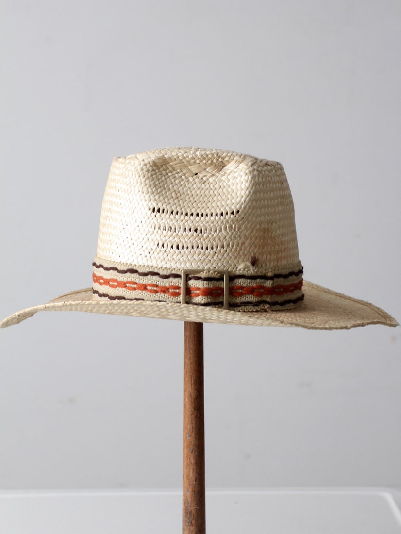 Vintage Straw Cowboy Hat with Woven Design and Belted Band: Vintage Straw Cowboy Hat with Woven Design and Belted Band This vintage straw cowboy hat showcases a natural woven design, featuring a tall crown and a belted woven hatband. Its lightweight and breath