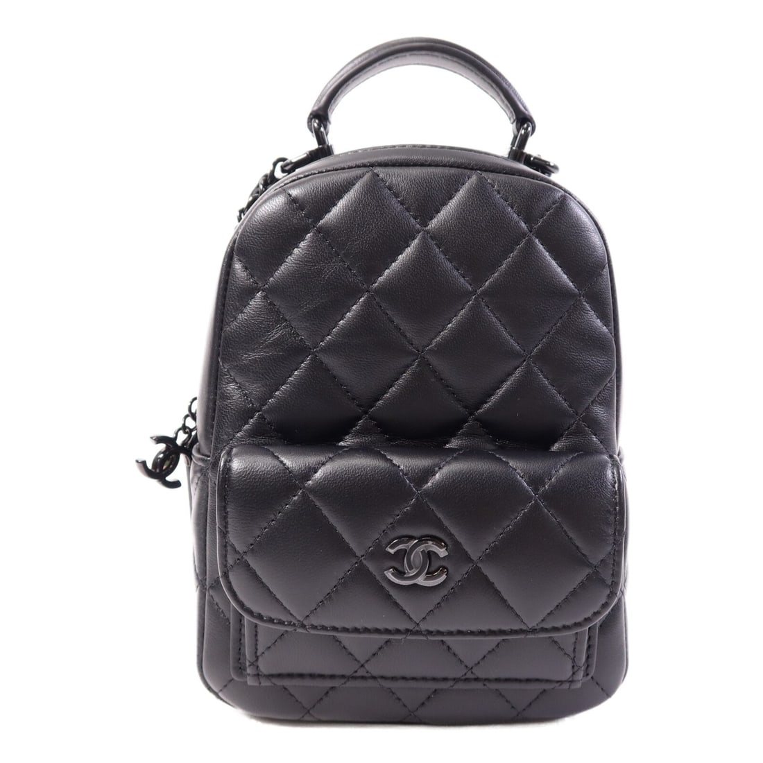 CHANEL AP3753 CC Mini Backpack Black Lambskin Leather: CHANEL AP3753 CC Mini Backpack Black Lambskin Leather This CHANEL CC Mini Backpack is a compact rucksack style bag crafted in black lambskin (sheep leather). It features a black frame color, one exter