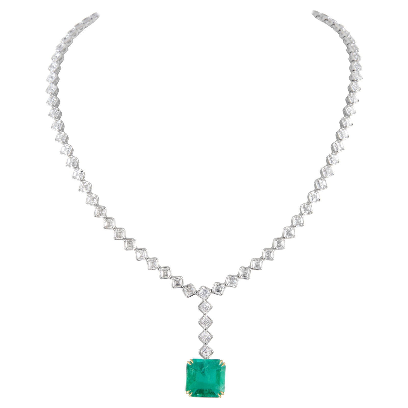 GIA 40.92ct Emerald Diamond Necklace 18k White Gold: GIA 40.92ct Emerald Diamond Necklace 18k White Gold This stunning GIA certified drop necklace features a magnificent 40.92 carat Brazilian emerald, expertly cut into an emerald shape, complemented by 