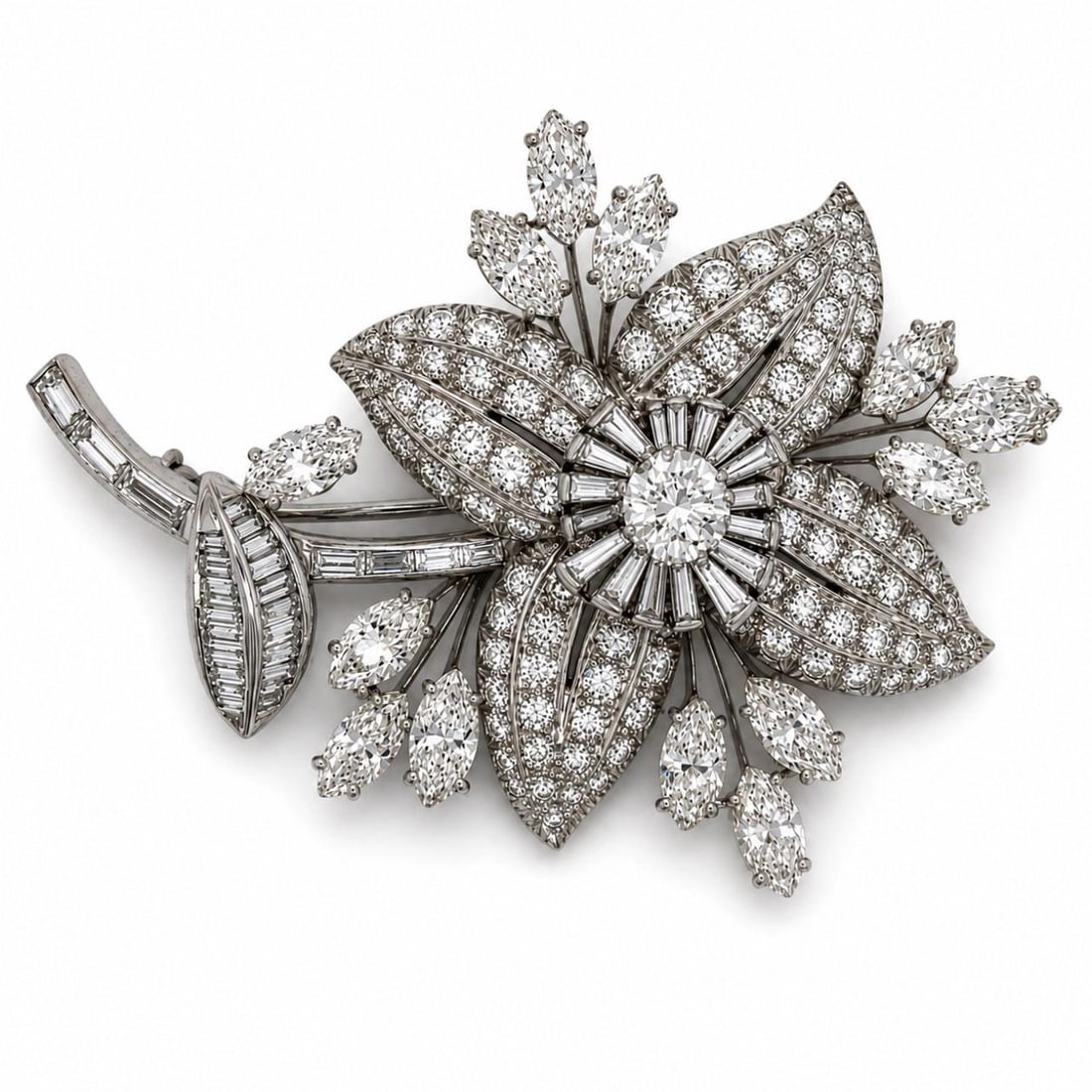 Tiffany & Co. Diamond Flower Brooch in Platinum 1960s: Tiffany & Co. Diamond Flower Brooch in Platinum 1960s A 1960's platinum diamond flower brooch featuring a floral design and set with marquise, round, baguette, and additional diamonds. The piece is pr