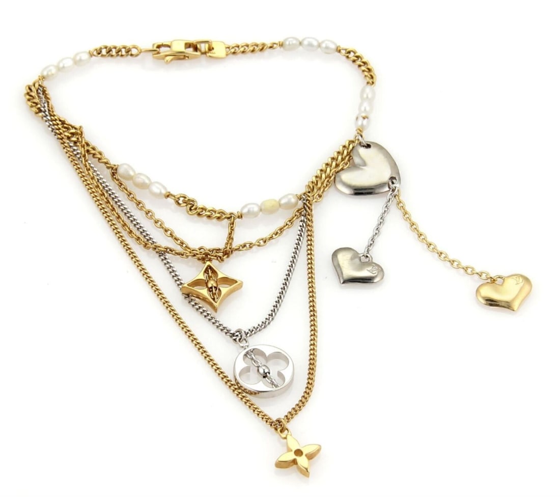 Louis Vuitton Monogram Pearls Multi Charm Bracelet in 18k Two Tone Gold: Louis Vuitton Monogram Pearls Multi Charm Bracelet in 18k Two Tone Gold A Louis Vuitton Monogram Pearls Multi-Charm Chain Bracelet crafted in 18k yellow and white gold with a two-tone finish. The desi