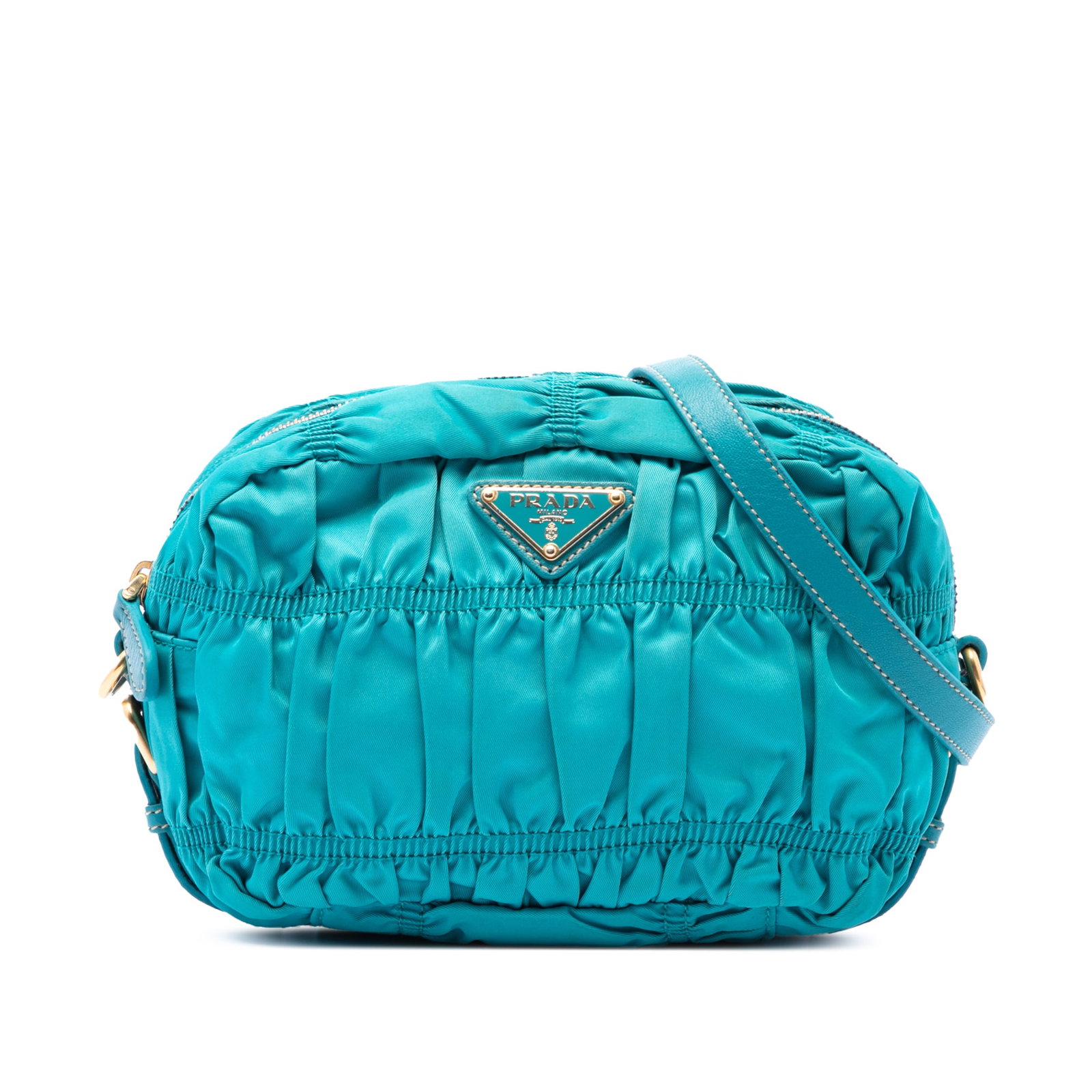 Prada Tessuto Gaufre Blue Nylon Crossbody Bag: Prada Tessuto Gaufre Blue Nylon Crossbody Bag This Prada Tessuto Gaufre crossbody bag is made with a gathered nylon body and features an adjustable, detachable flat leather strap, a top zip closure, a