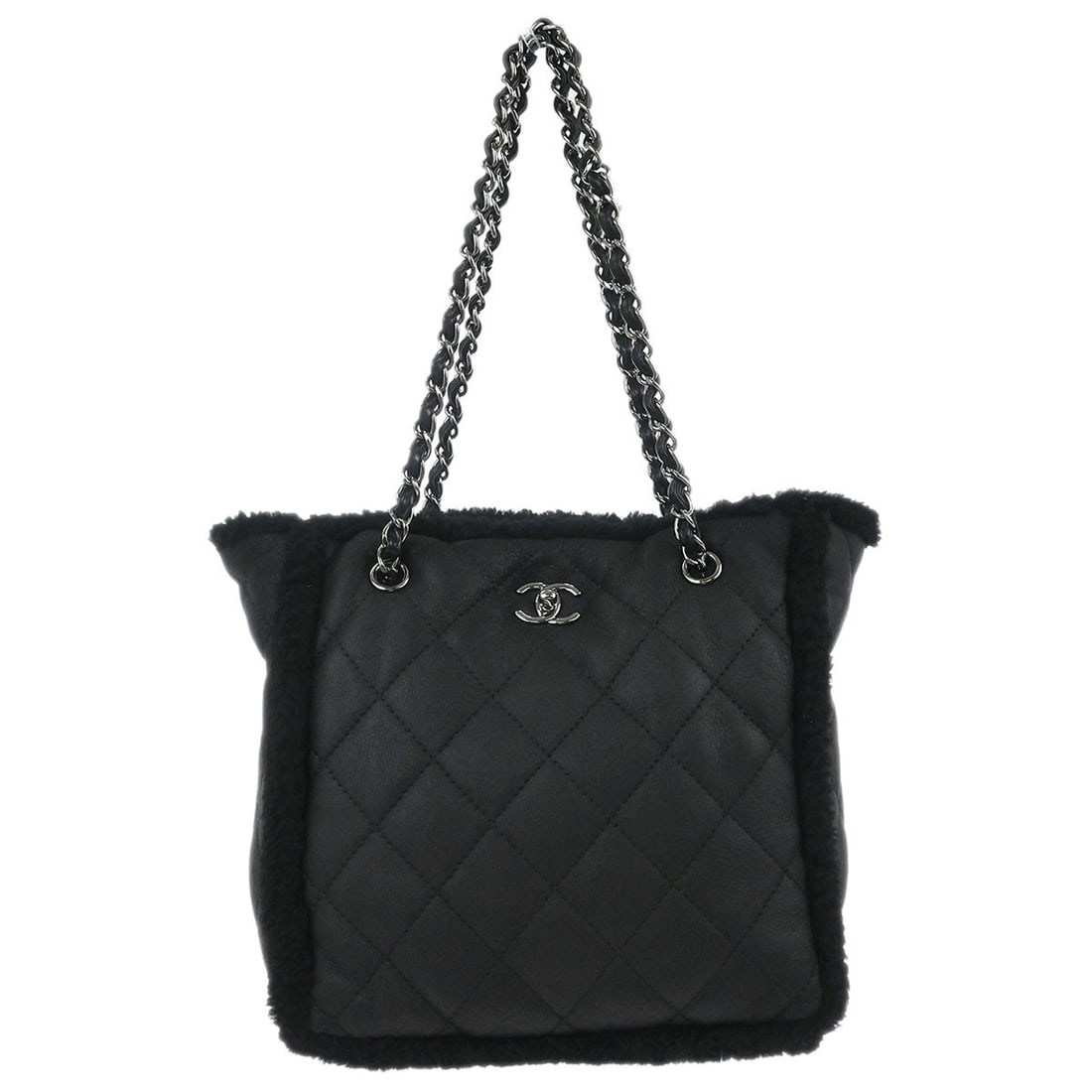 CHANEL Mouton Tote Bag Black Chain Handles Turn Lock: CHANEL Mouton Tote Bag Black Chain Handles Turn Lock Medium Chanel tote bag in black mouton with double leather handles and chain accents. It features a turn-lock closure, logo detailing, inner storag