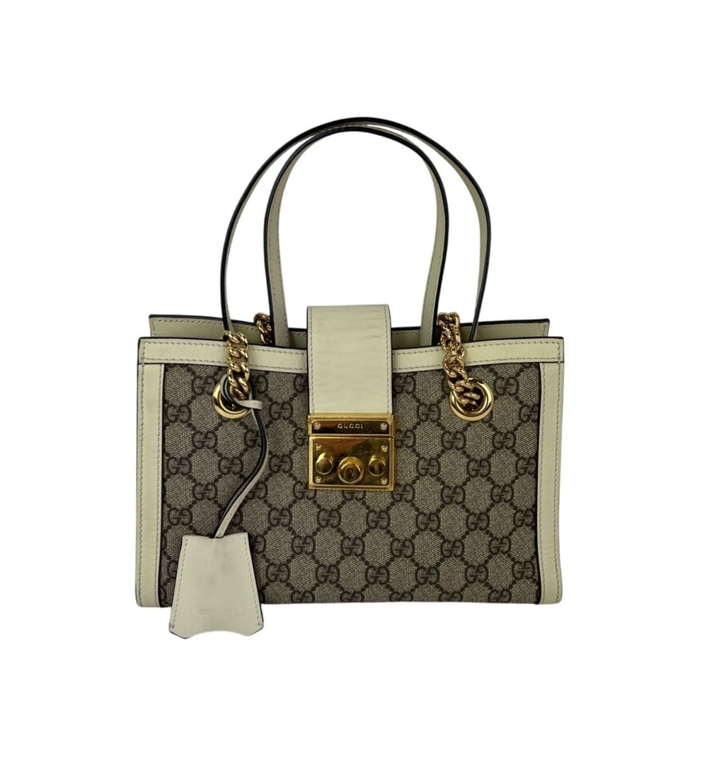 Gucci Padlock Small Tote GG Supreme Canvas Leather Brown Handbag: Gucci Padlock Small Tote GG Supreme Canvas Leather Brown Handbag This Gucci GG Supreme Small Padlock Tote Bag features a rectangular silhouette crafted from coated canvas and leather in a classic brow