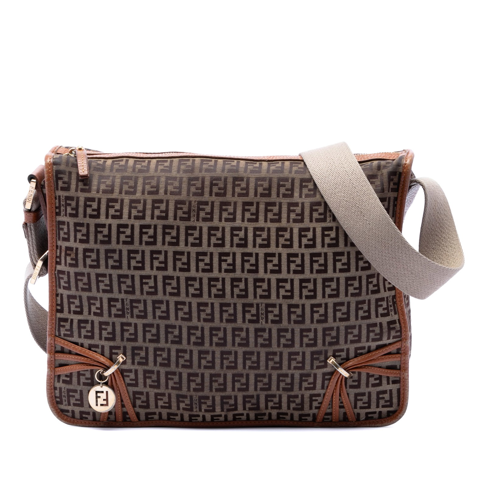 Fendi Zucchino F Charm Crossbody Bag in Beige Canvas: Fendi Zucchino F Charm Crossbody Bag in Beige Canvas Fendi Zucchino Canvas F Charm Crossbody bag in beige, made in Italy. It features a canvas body with leather trim, an adjustable flat canvas strap, 