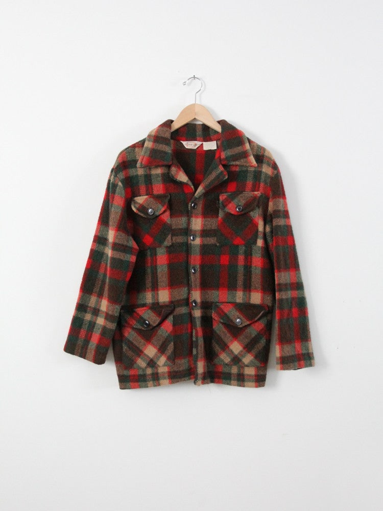1970s Career Club Plaid Wool Blend Men's Jacket: 1970s Career Club Plaid Wool Blend Men's Jacket Embrace the charm of the 1970s with this vintage plaid wool coat. Crafted from a soft wool blend, this men's jacket by Career Club showcases a striking 